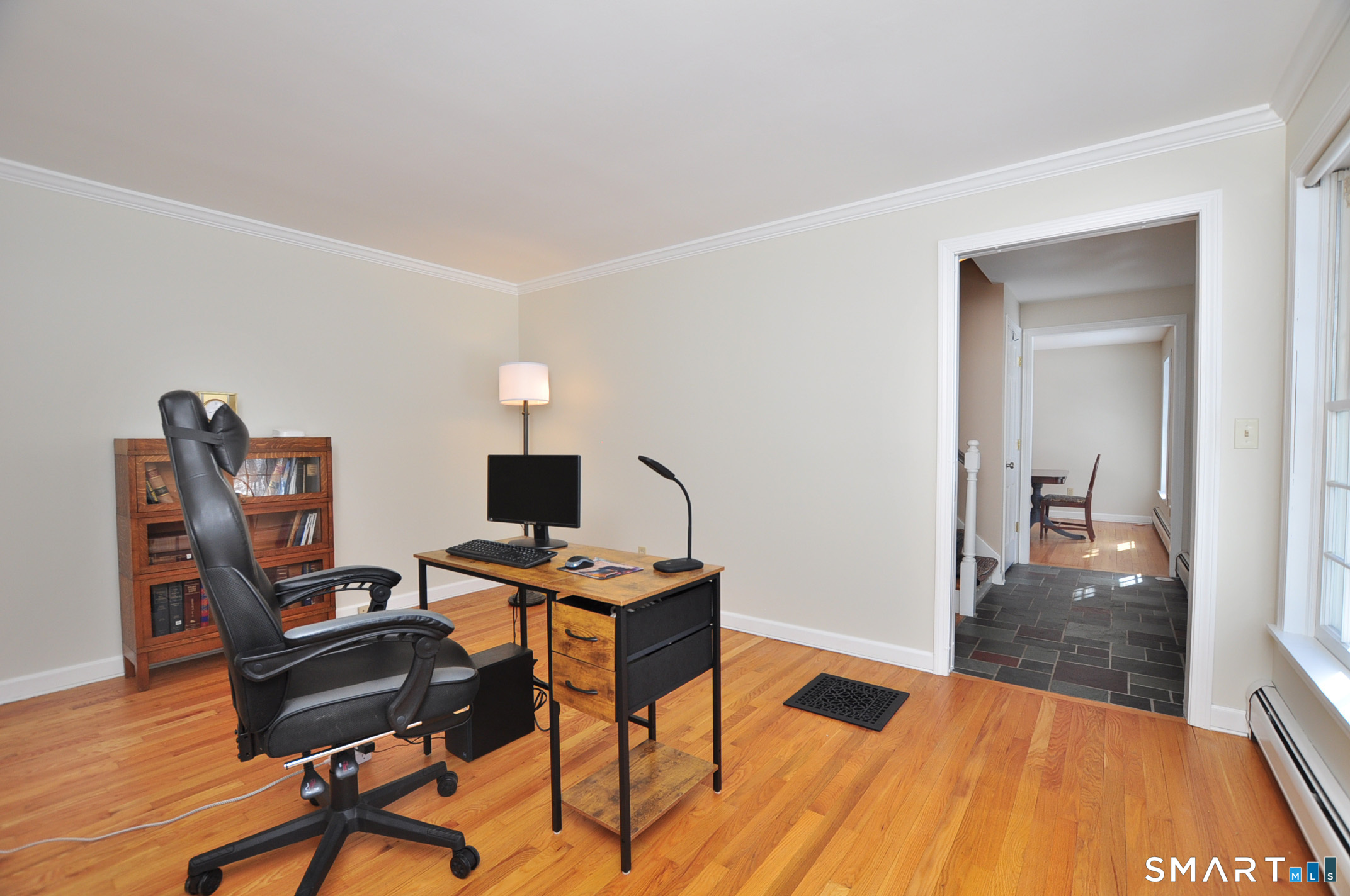 102 Petersen Road Granby, CT 06035 - Photo 20 of 40 a view of a workspace with furniture and wooden floor