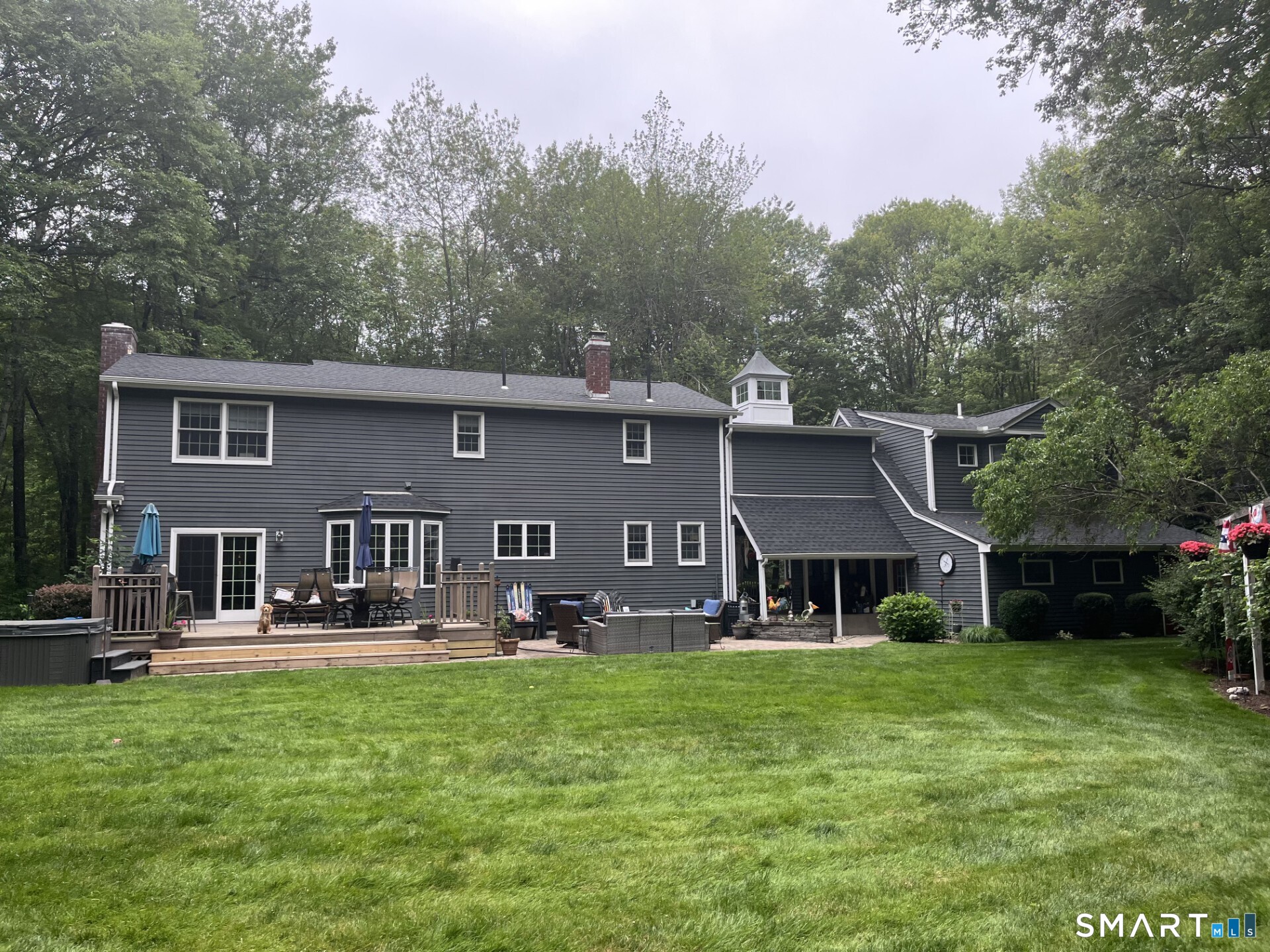 102 Petersen Road Granby, CT 06035 - Photo 2 of 40 a front view of a house with garden