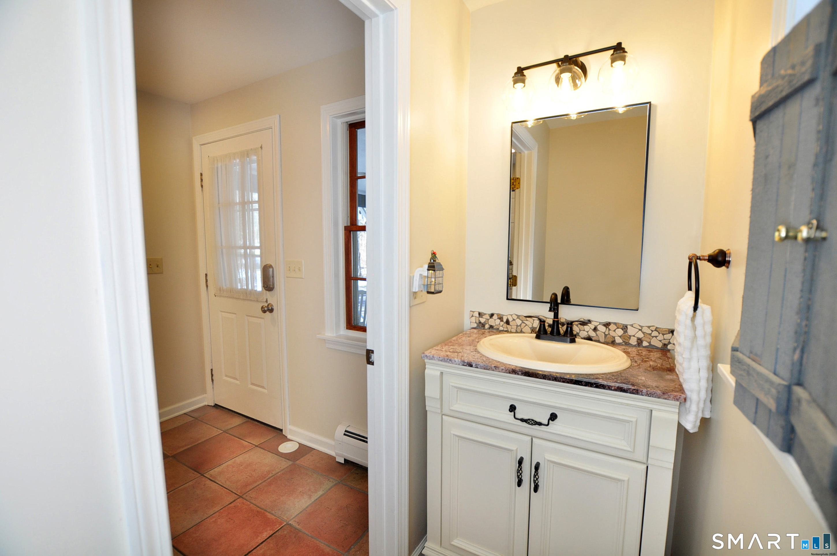 102 Petersen Road Granby, CT 06035 - Photo 22 of 40 a bathroom with a sink and a mirror