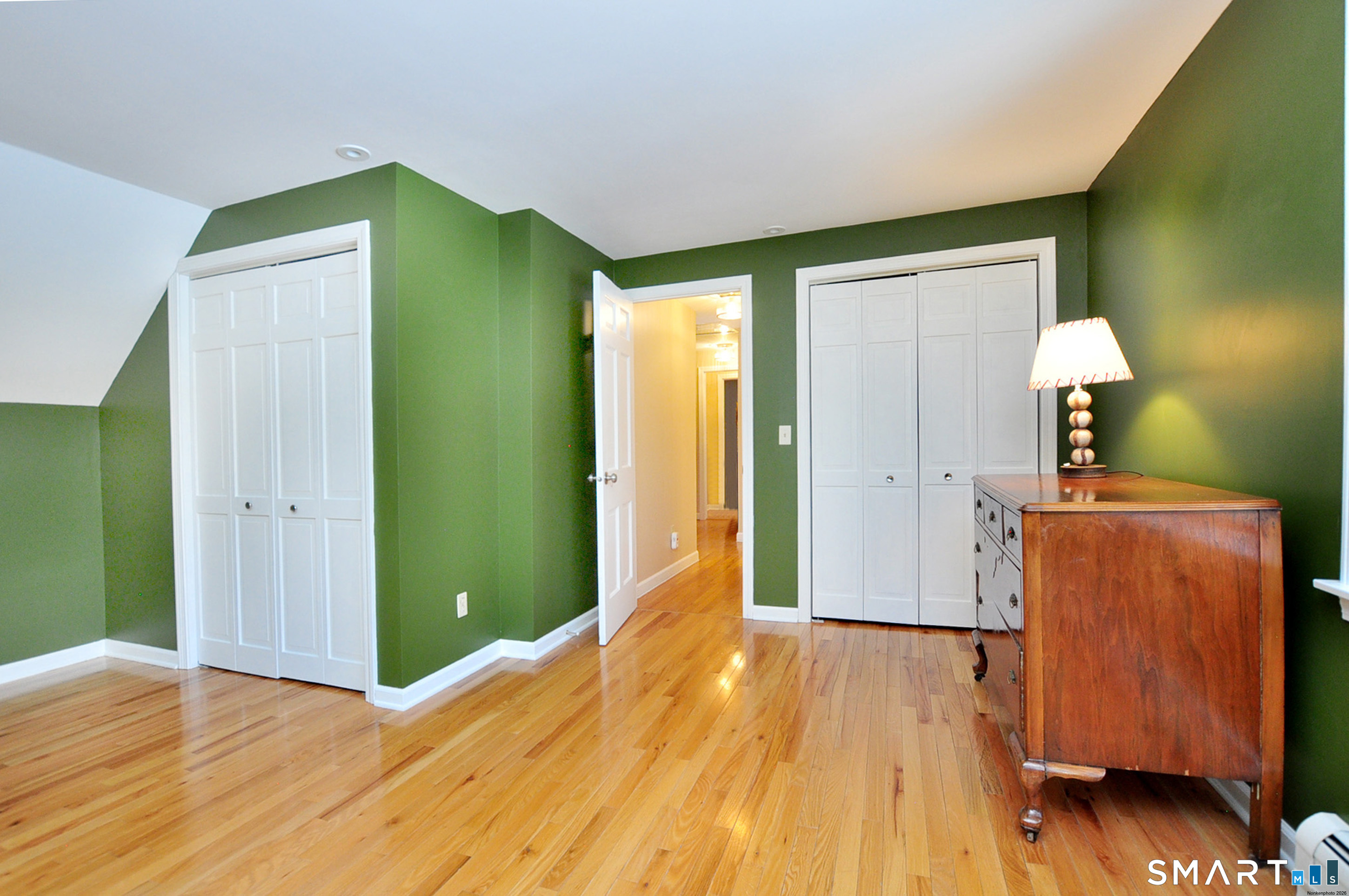 102 Petersen Road Granby, CT 06035 - Photo 27 of 40 a view of a room with wooden floor and a cabinet
