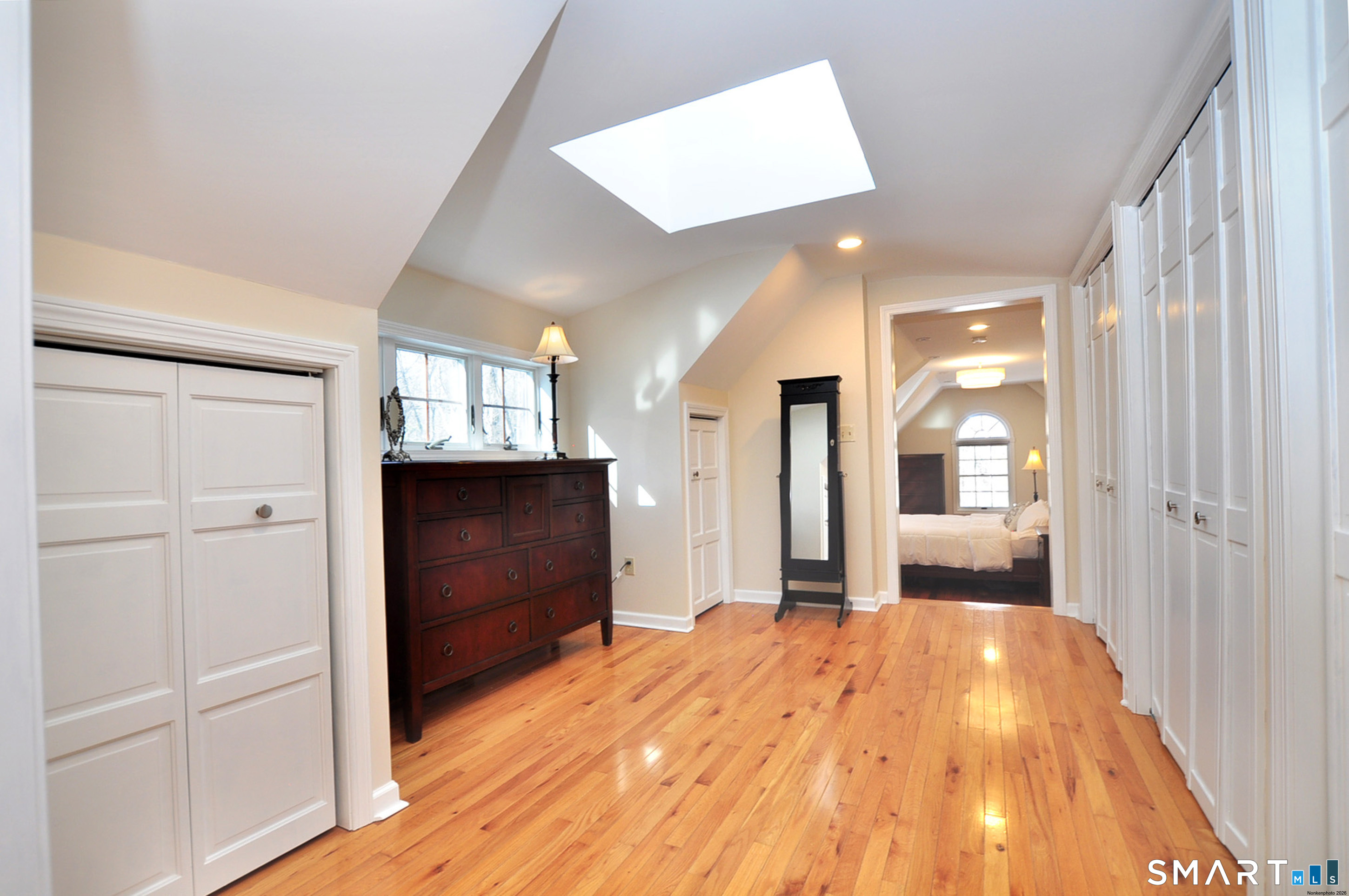 102 Petersen Road Granby, CT 06035 - Photo 30 of 40 a view of a hallway with wooden floor and closet