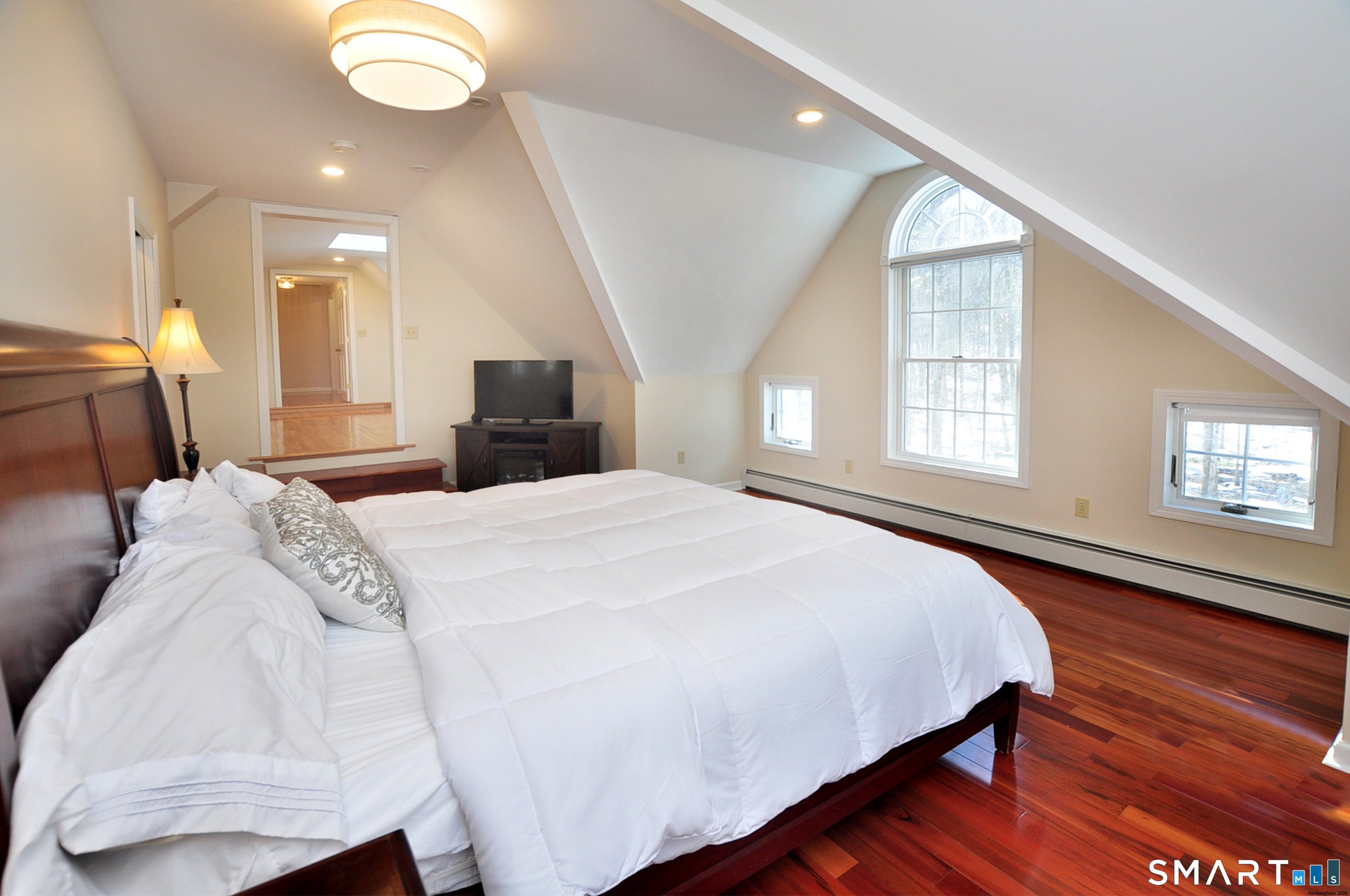 102 Petersen Road Granby, CT 06035 - Photo 31 of 40 a spacious bedroom with a bed and a window