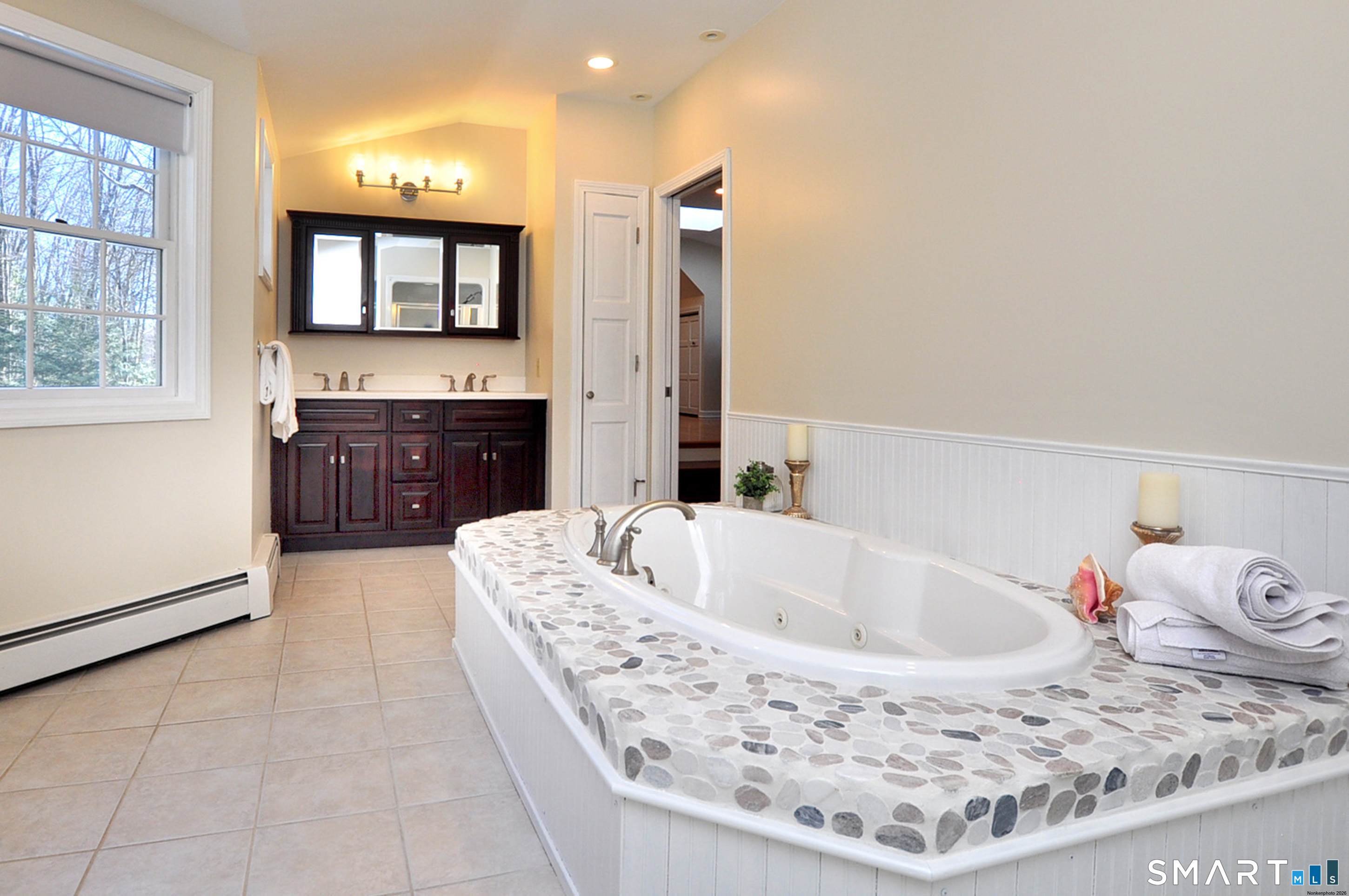 102 Petersen Road Granby, CT 06035 - Photo 33 of 40 a living room with furniture and a flat screen tv