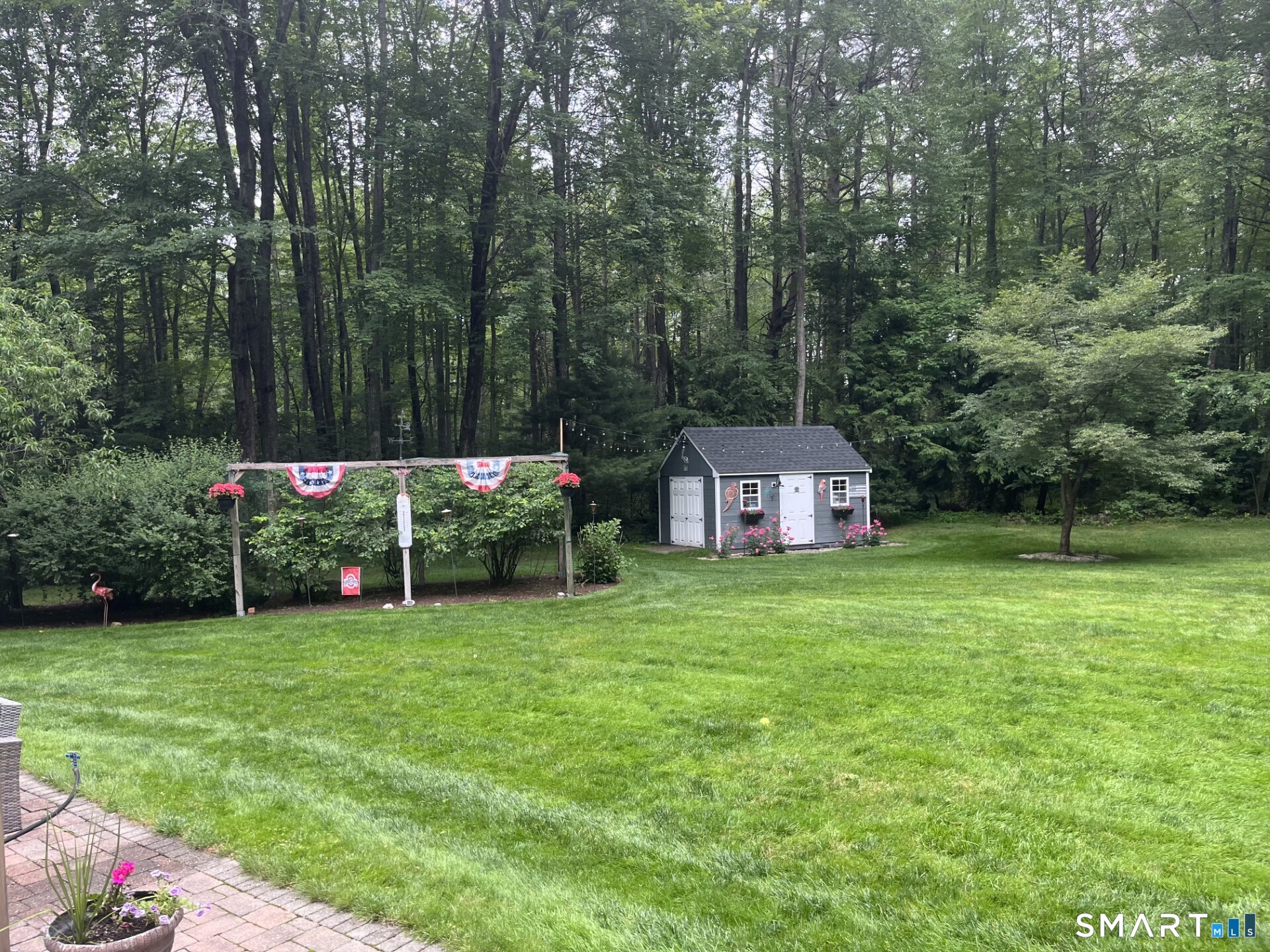 102 Petersen Road Granby, CT 06035 - Photo 37 of 40 a view of a house with a big yard and large trees