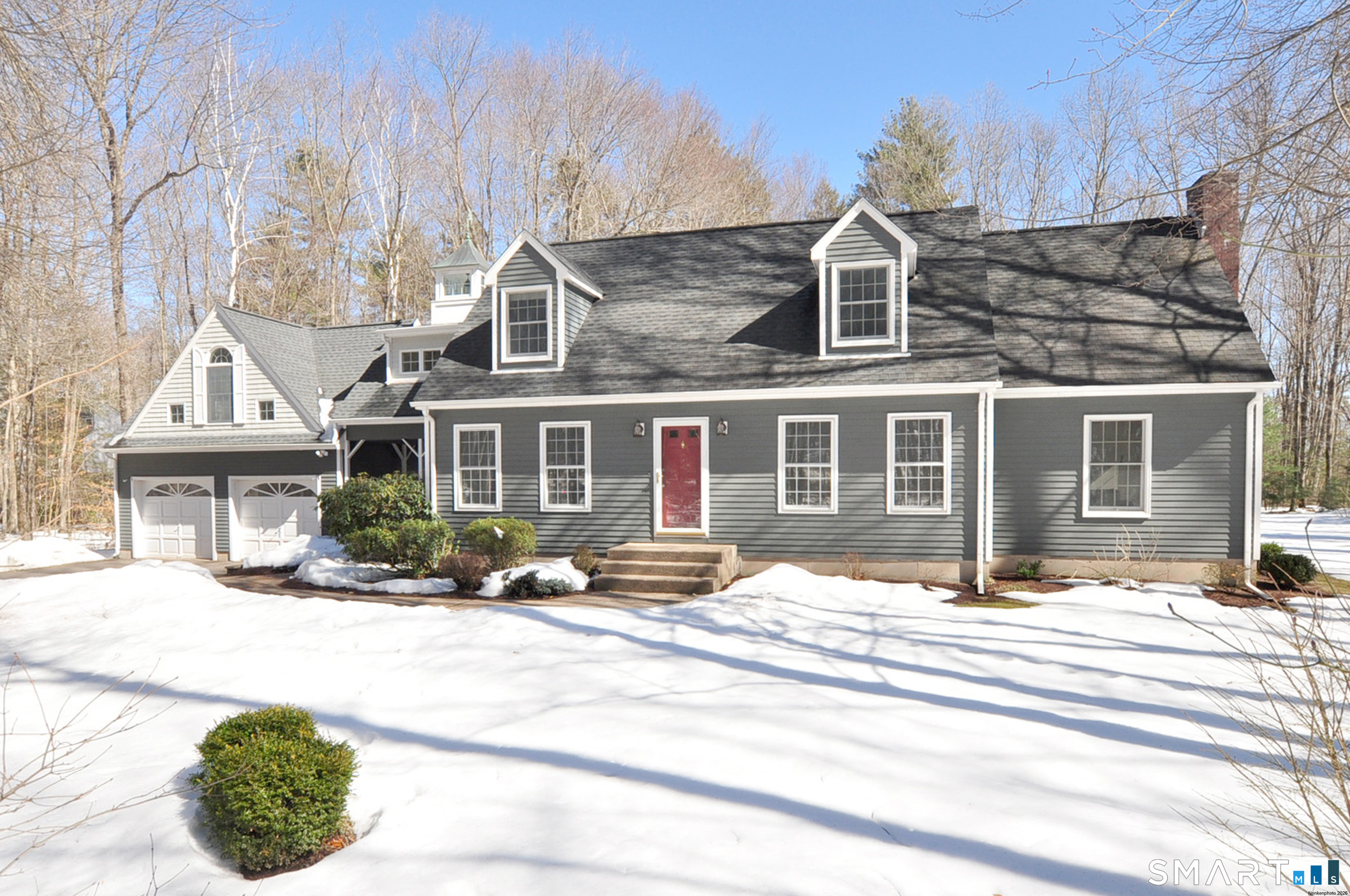 102 Petersen Road Granby, CT 06035 - Photo 40 of 40 a front view of a house with a yard