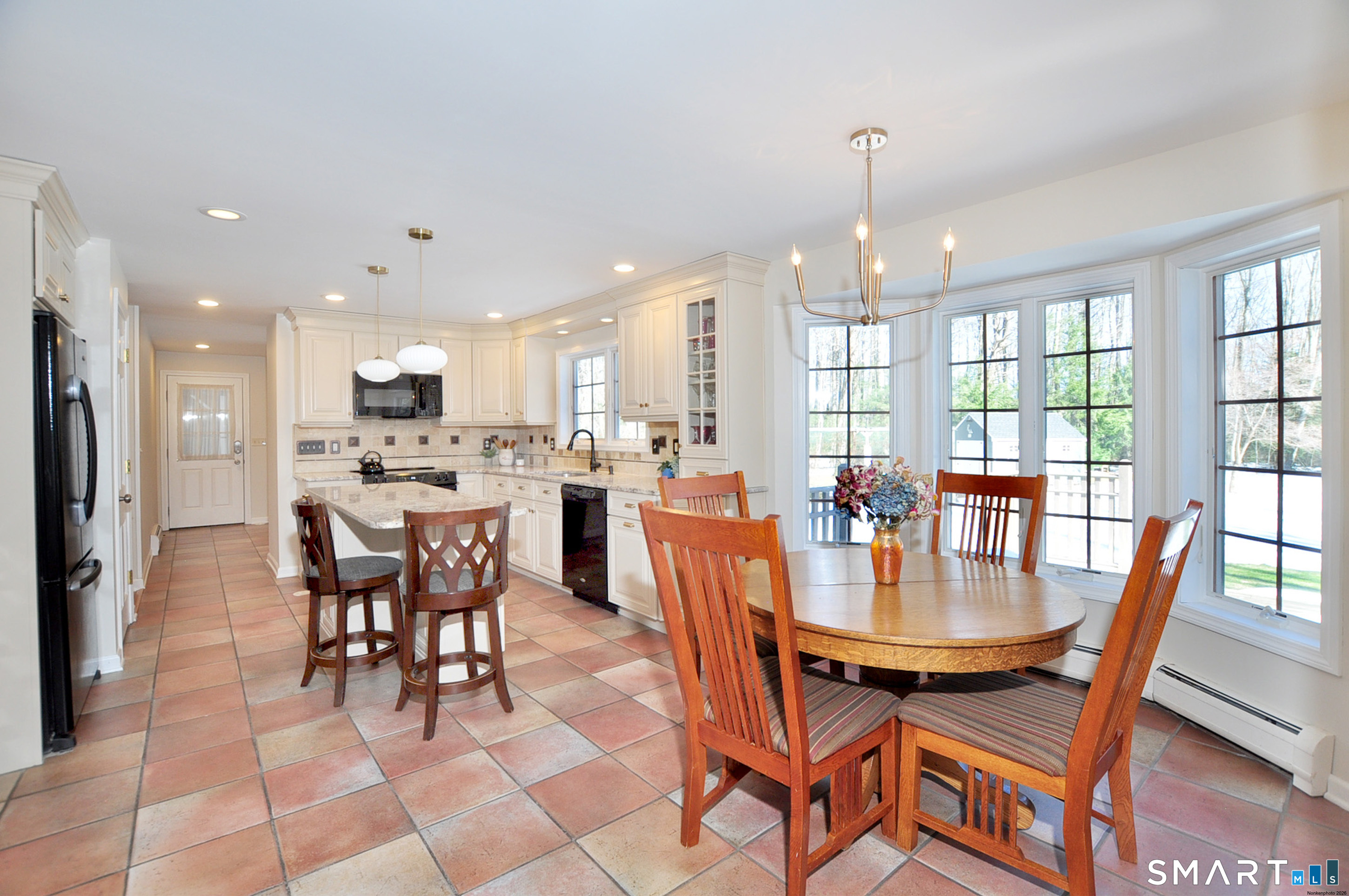 102 Petersen Road Granby, CT 06035 - Photo 4 of 40 a view of a dining room with furniture