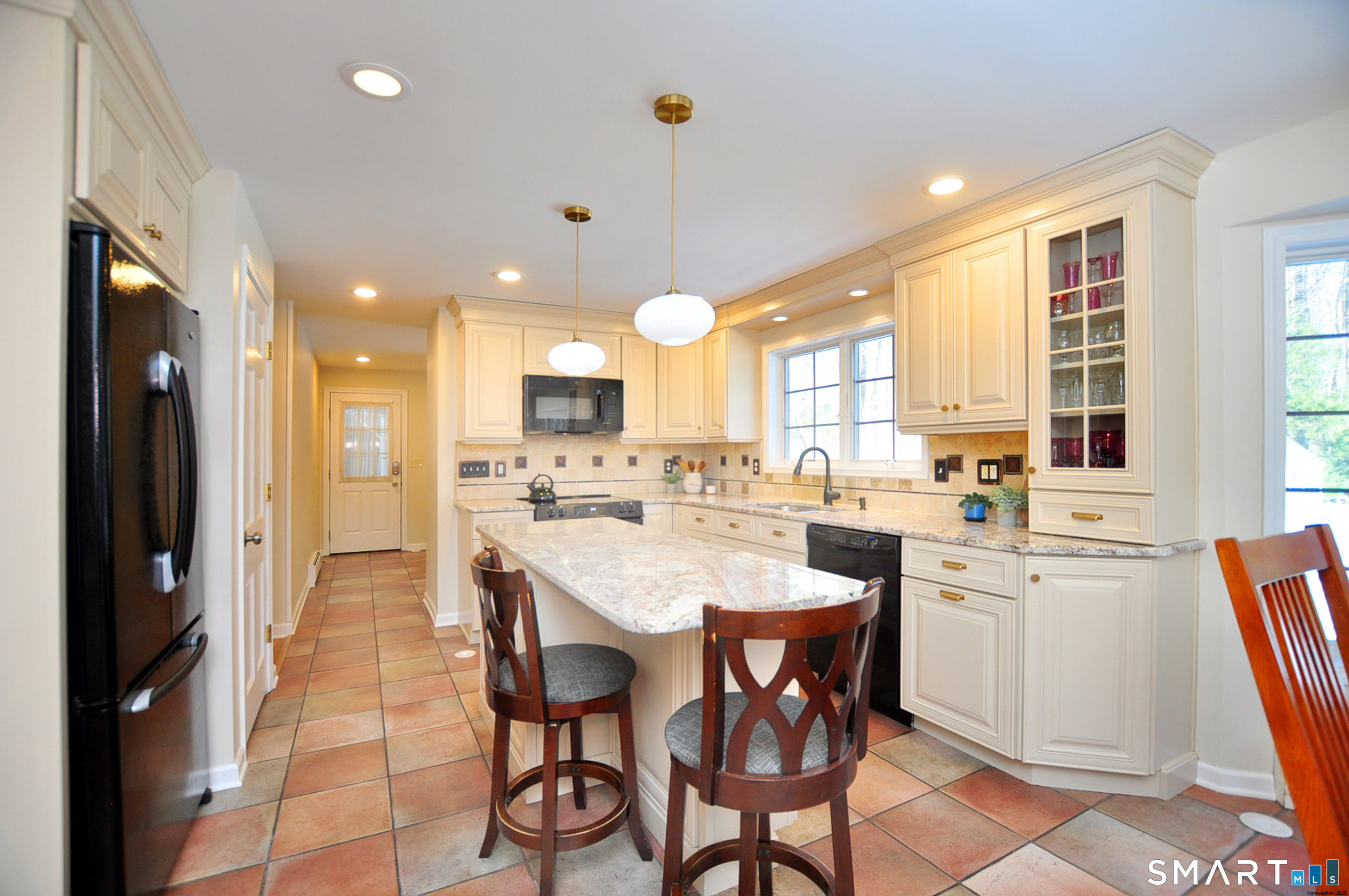 102 Petersen Road Granby, CT 06035 - Photo 6 of 40 a large kitchen with a table and chairs