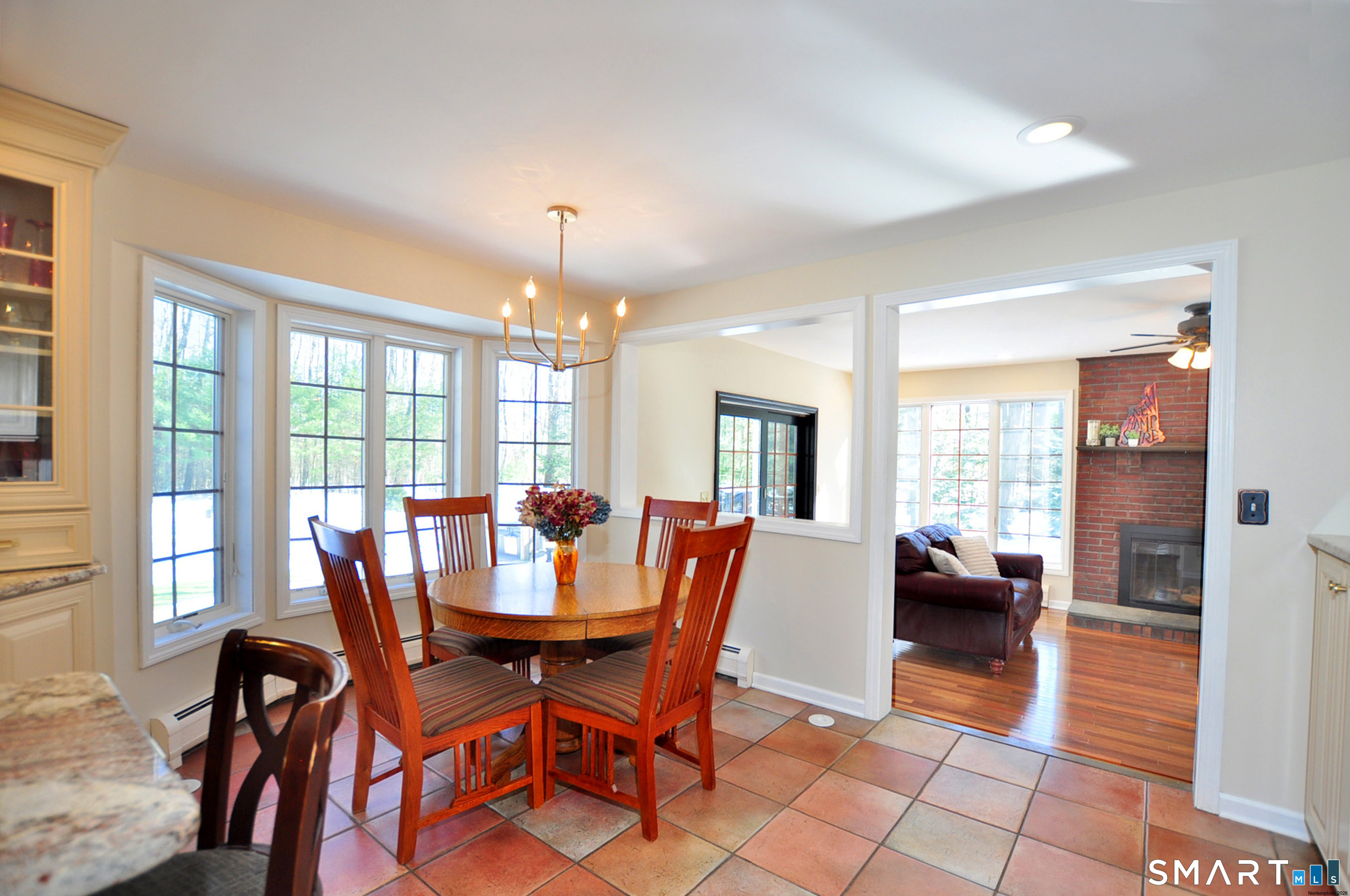 102 Petersen Road Granby, CT 06035 - Photo 10 of 40 a view of a dining room with furniture window and outside view
