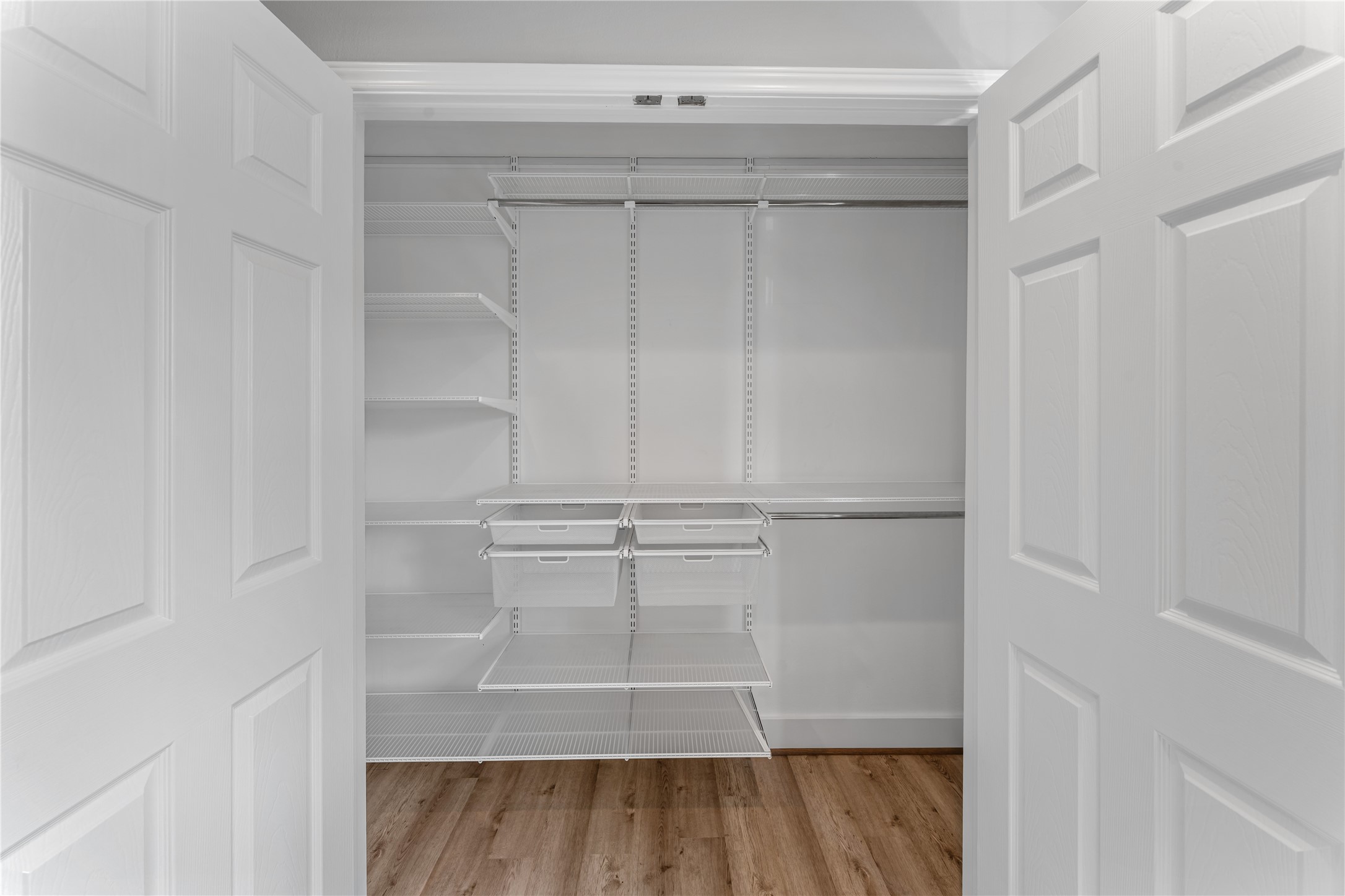809 East 40th Street Houston, TX 77022 - Photo 17 of 27 Spacious walk-in closet with built-in shelving provides excellent organization and storage options. Designed for functionality, this space complements the home’s fully updated interior.