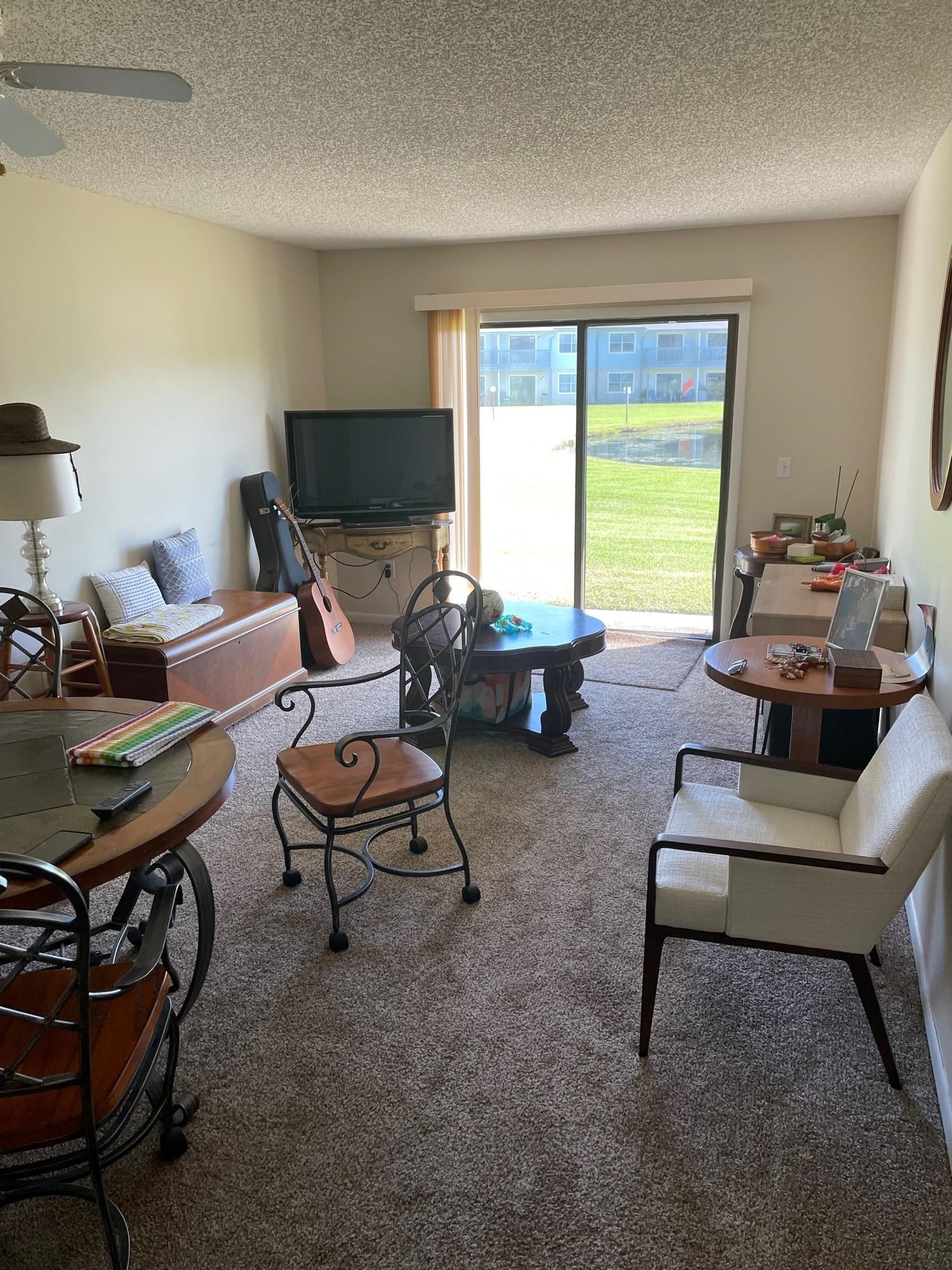 700 West Pope Road, Unit J75 St. Augustine, FL 32080 - Photo 3 of 7 a living room with furniture and a window