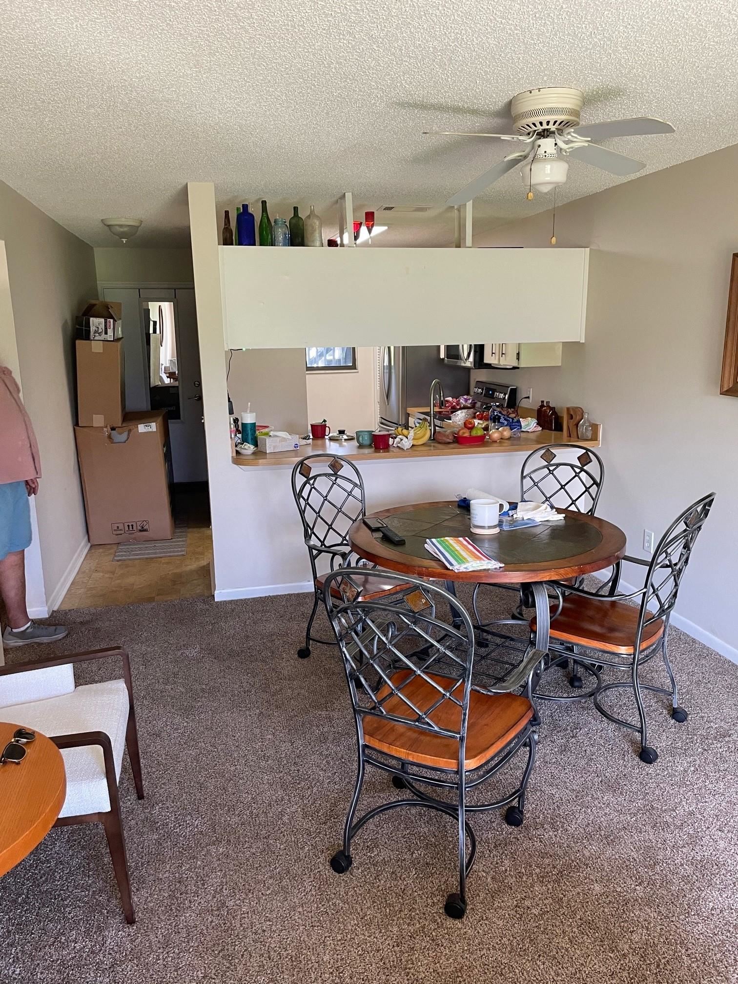 700 West Pope Road, Unit J75 St. Augustine, FL 32080 - Photo 4 of 7 a dining room with furniture and a chandelier fan