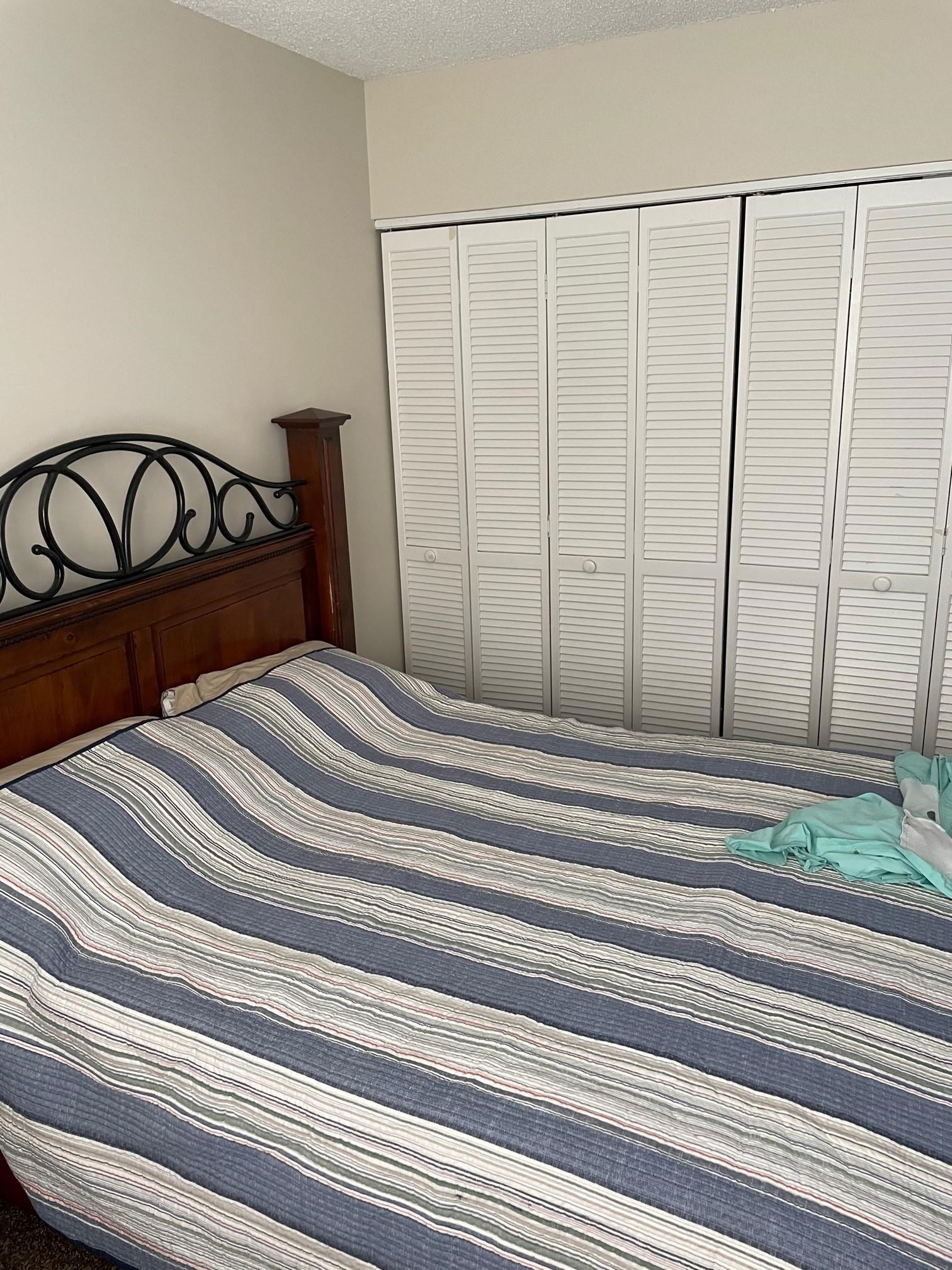 700 West Pope Road, Unit J75 St. Augustine, FL 32080 - Photo 5 of 7 a bedroom with a bed and a window