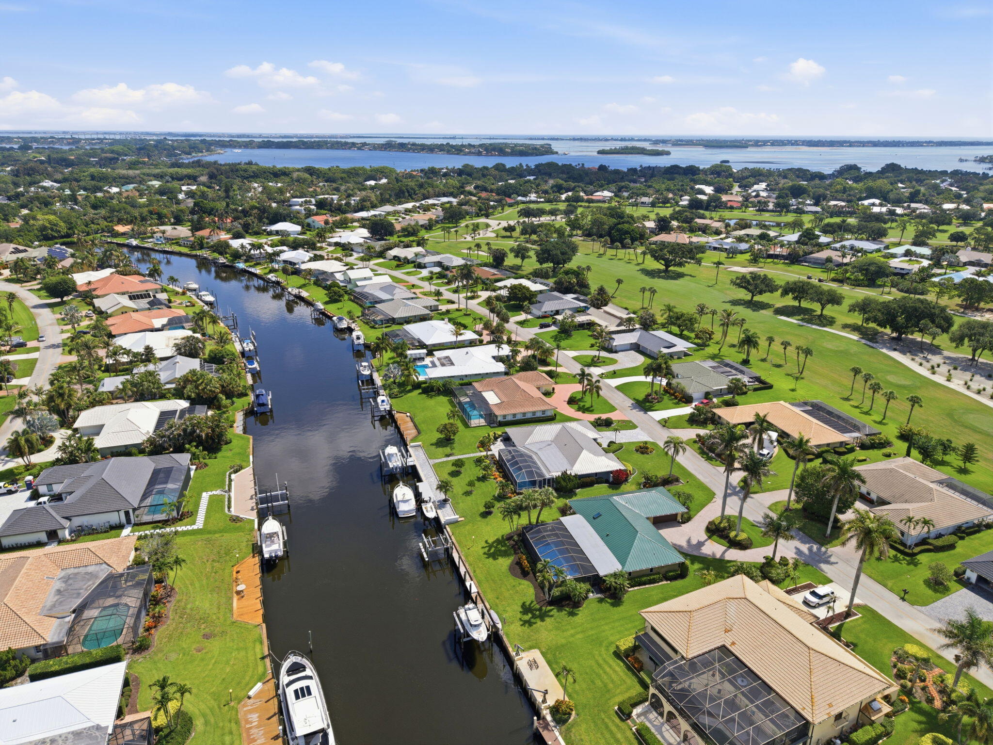 3374 Southeast Fairway East Stuart, FL 34997 - Photo 53 of 65 an aerial view of residential houses with outdoor space