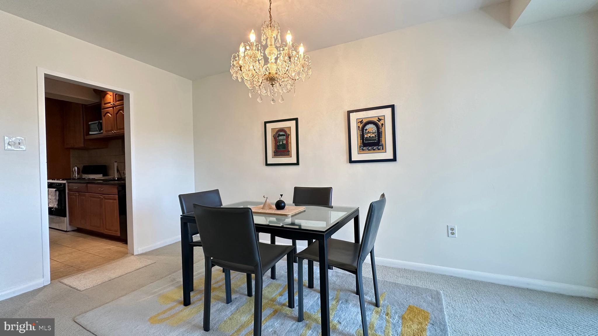 4201 Cathedral Avenue Northwest, Unit 1121E Washington, DC 20016 - Photo 12 of 25 a view of a dining room with furniture