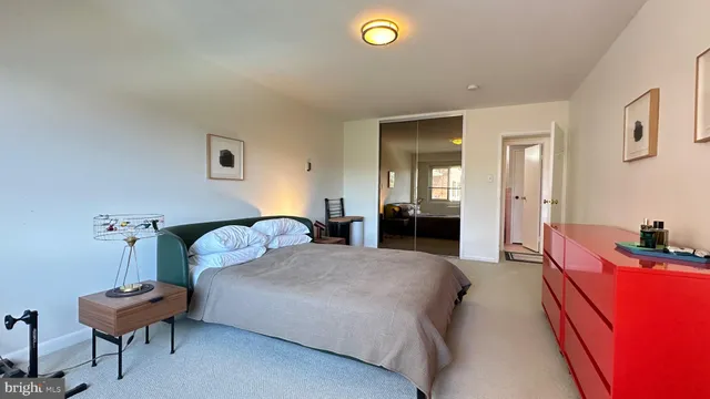 a bedroom with a bed and a couch