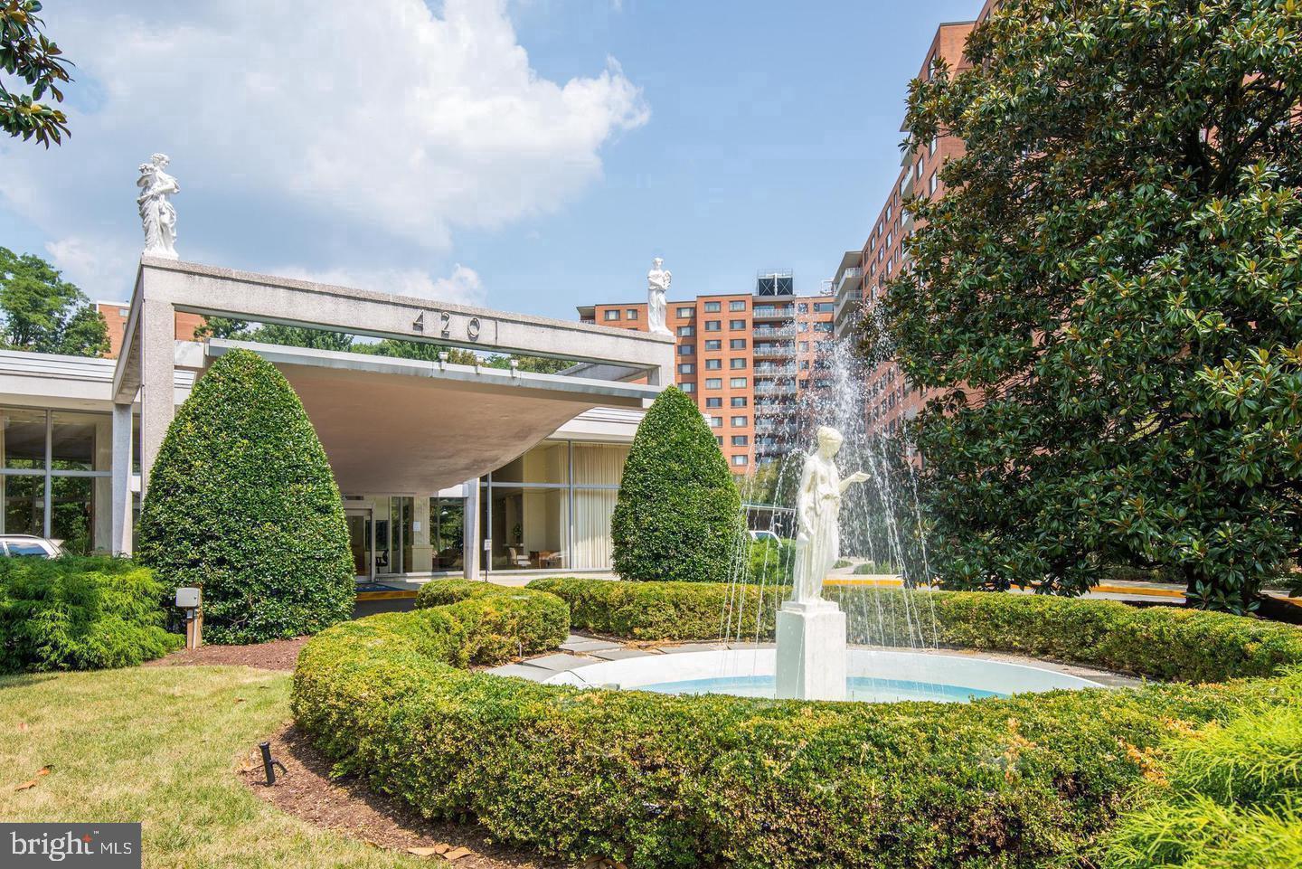 4201 Cathedral Avenue Northwest, Unit 1121E Washington, DC 20016 - Photo 2 of 25 a front view of a house with garden