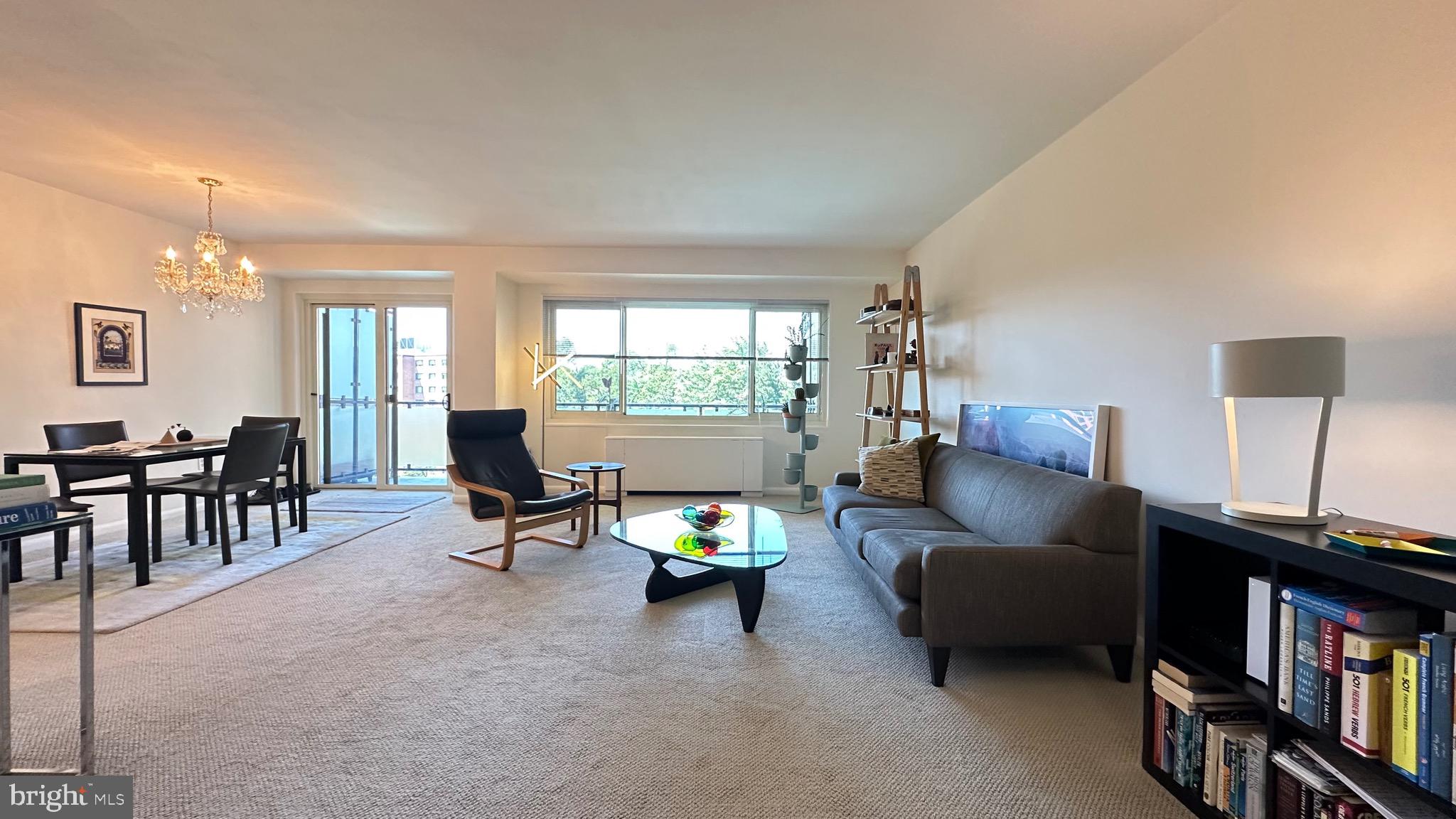 4201 Cathedral Avenue Northwest, Unit 1121E Washington, DC 20016 - Photo 5 of 25 a living room with furniture and a window