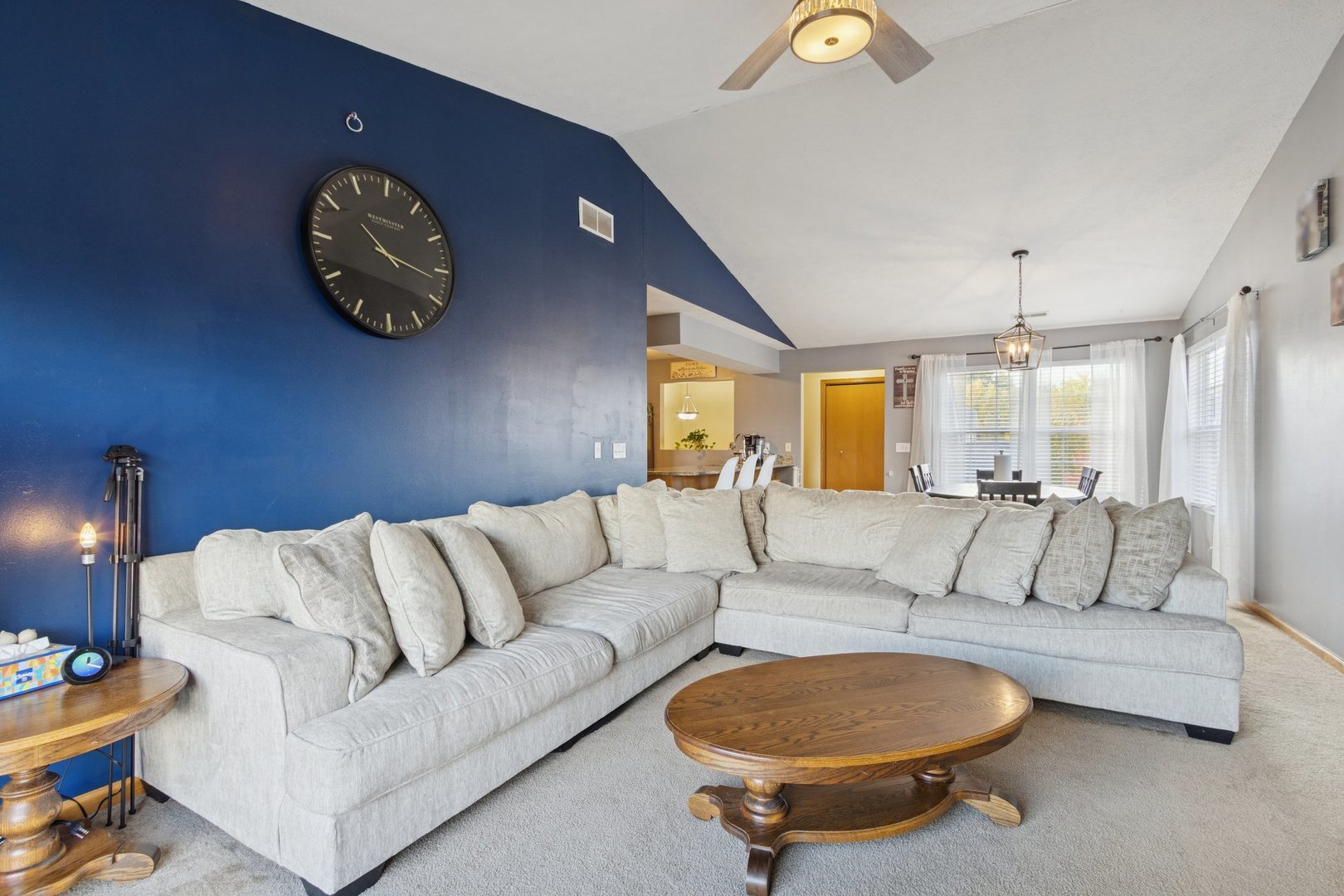 145 Penny Lane, Unit 1 Sycamore, IL 60178 - Photo 13 of 30 a living room with furniture and a chandelier