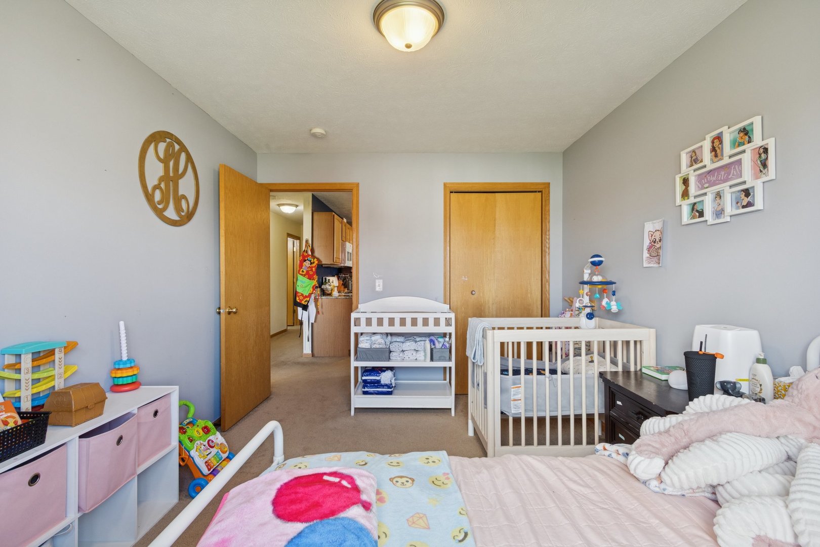 145 Penny Lane, Unit 1 Sycamore, IL 60178 - Photo 25 of 30 a bedroom with a bed and a window