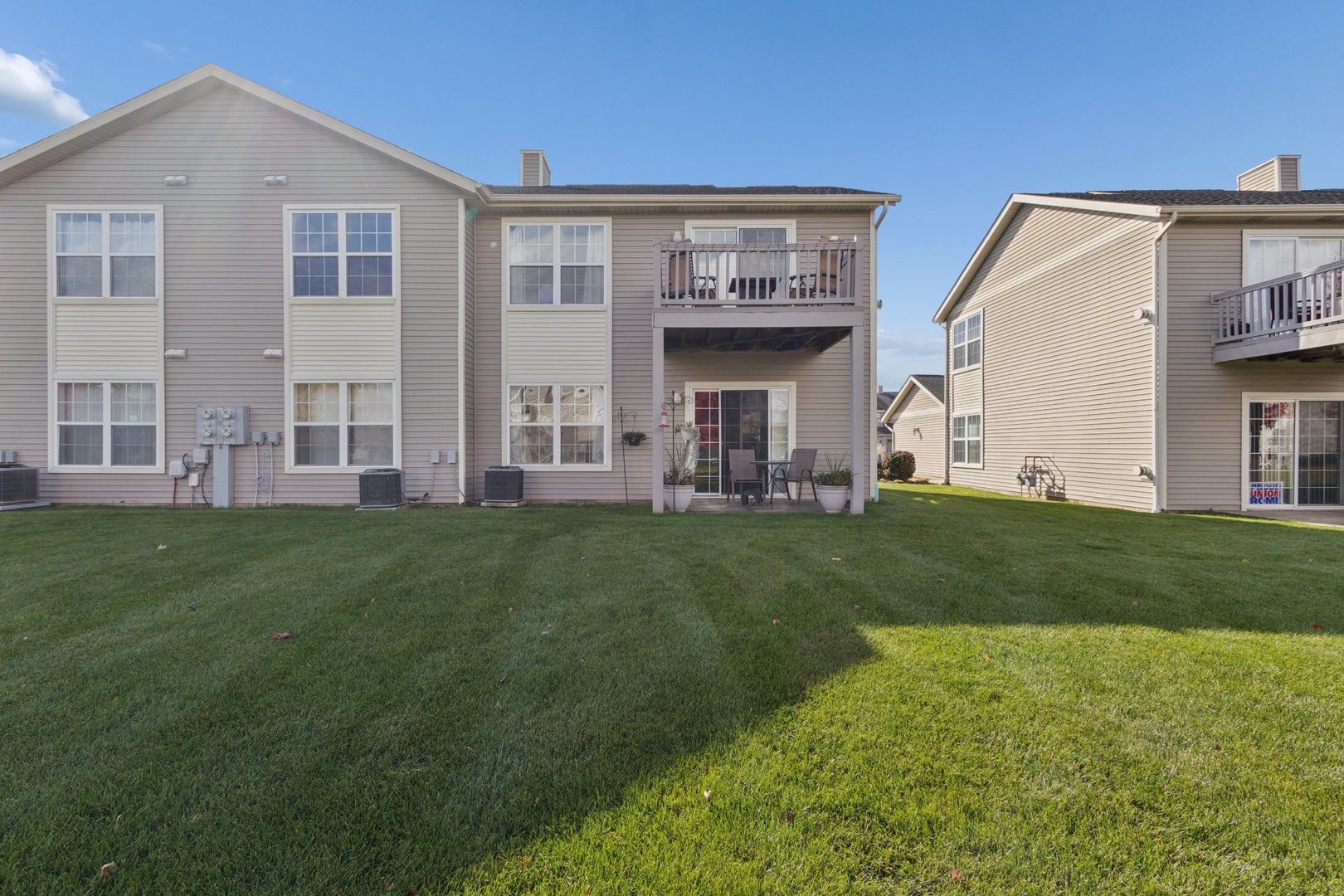 145 Penny Lane, Unit 1 Sycamore, IL 60178 - Photo 27 of 30 a view of a house with a backyard