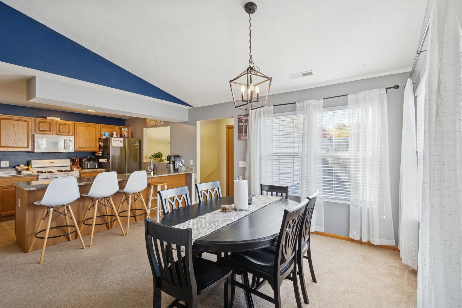 145 Penny Lane, Unit 1 Sycamore, IL 60178 - Photo 5 of 30 a view of a dining room with furniture window and outside view