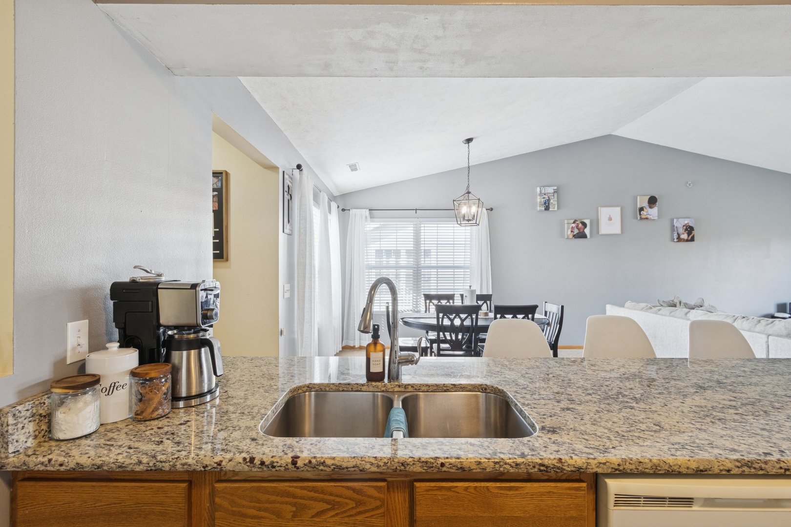 145 Penny Lane, Unit 1 Sycamore, IL 60178 - Photo 8 of 30 a kitchen with granite countertop a sink and a counter top space