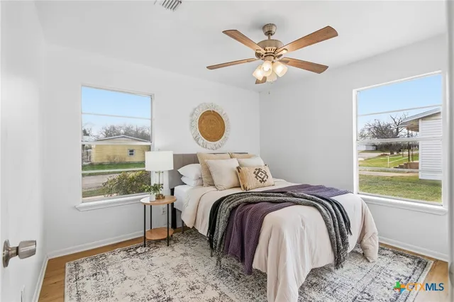a bedroom with a bed and window