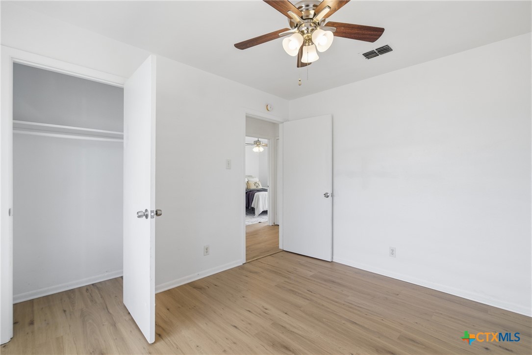 958 Fannin Loop Temple, TX 76501 - Photo 17 of 30 wooden floor in an empty room with a window