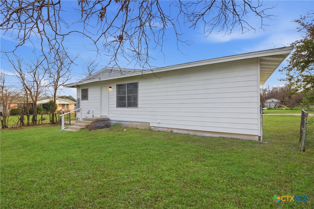 958 Fannin Loop Temple, TX 76501 - Photo 23 of 30 a backyard of a house with table and chairs