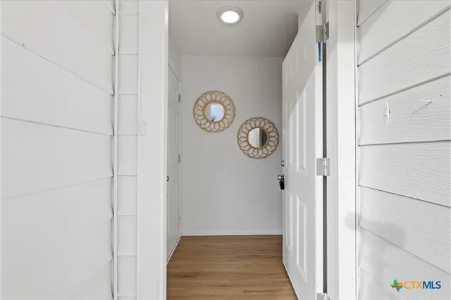 a view of a hallway with elevator