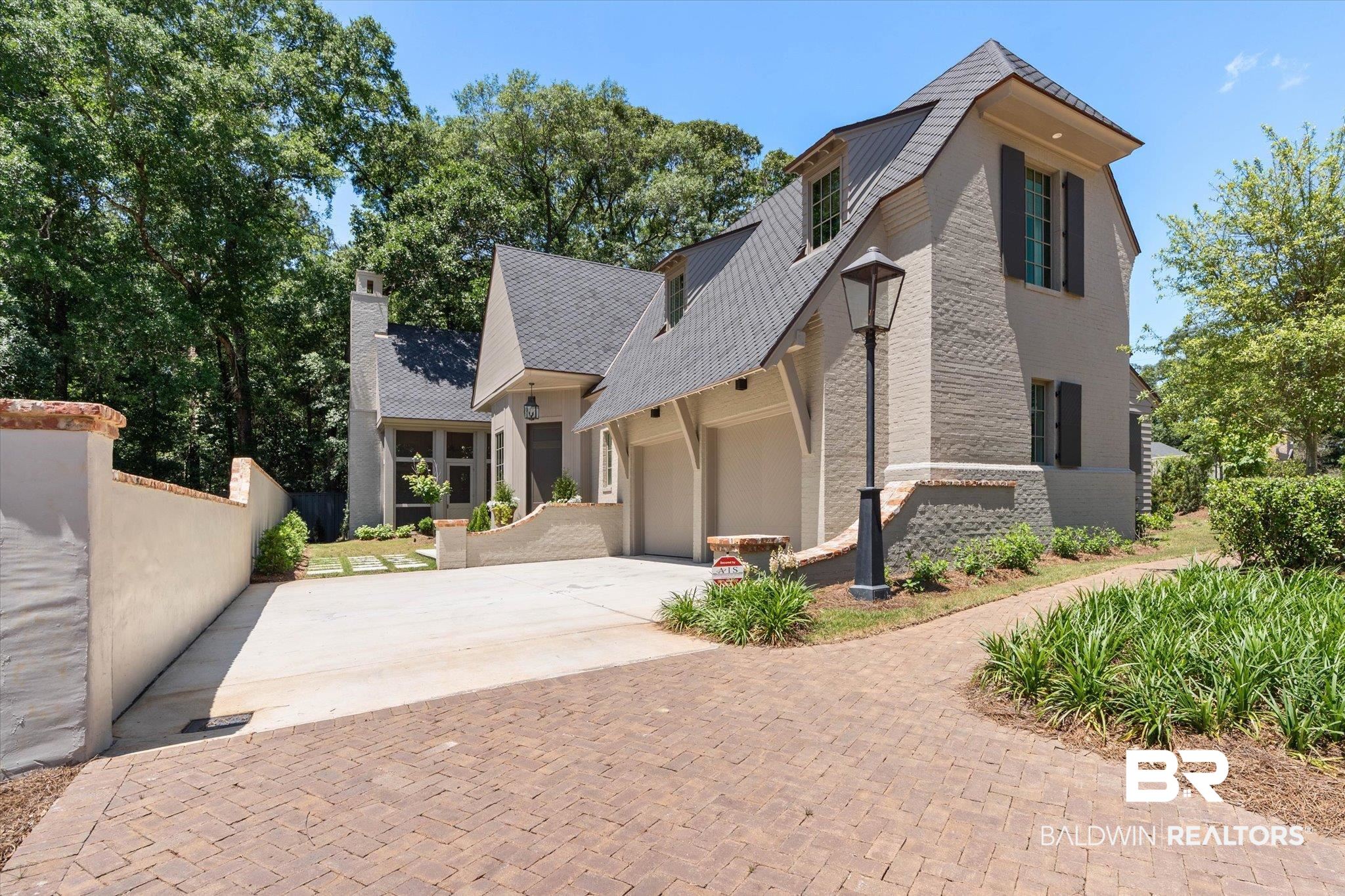 3 Canterbury Park Mobile, AL 36608 - Photo 1 of 43 View of home's exterior featuring driveway, an attached garage, fence, a chimney, and stucco siding