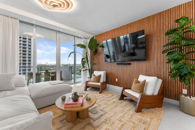 a balcony with furniture and a garden