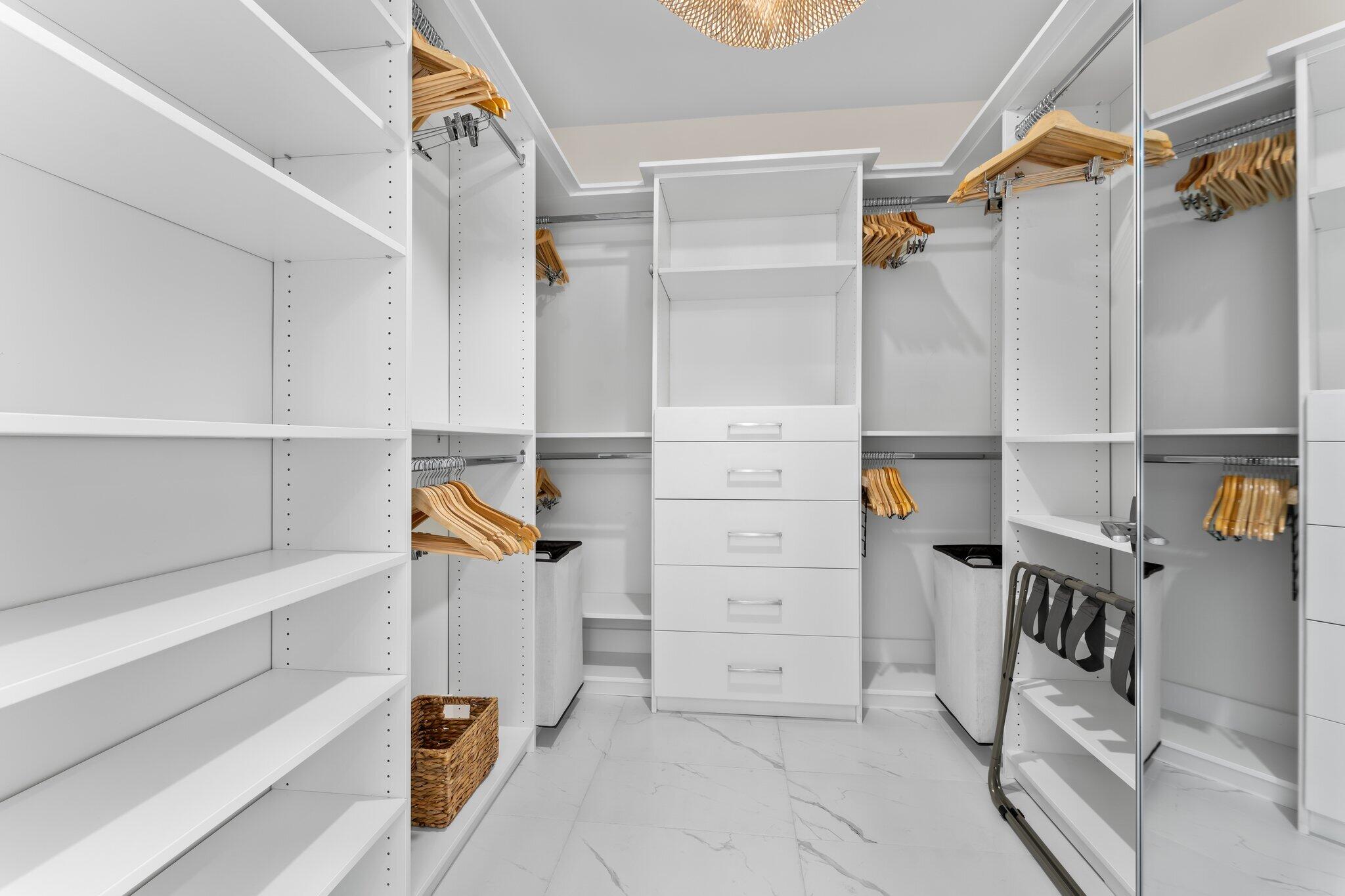 3100 North Ocean Drive, Unit H1006 Singer Island, FL 33404 - Photo 48 of 110 a view of walk in closet with clothes and shoes