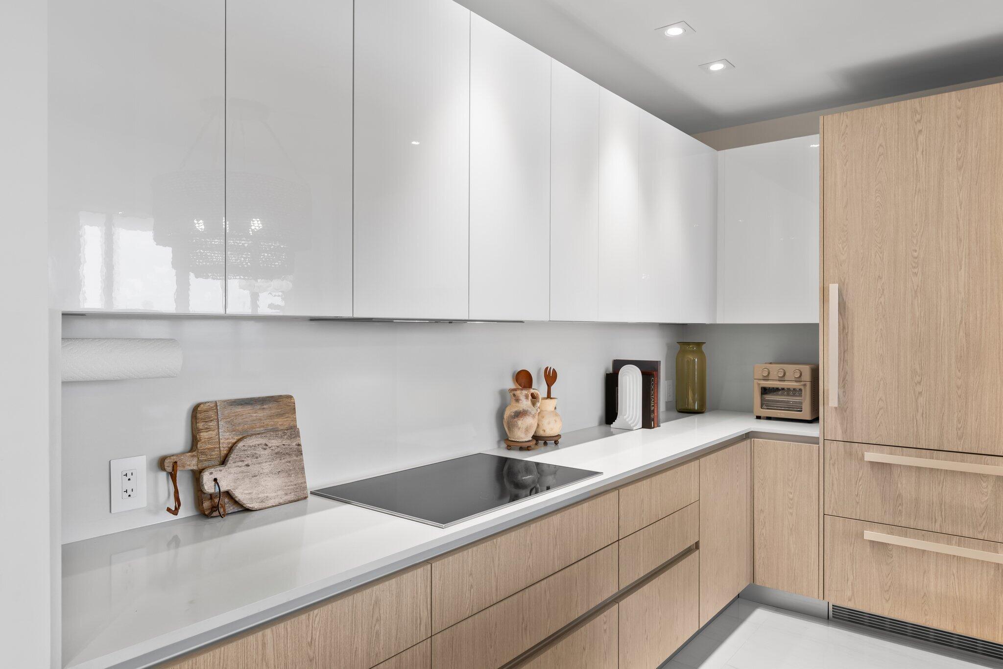 3100 North Ocean Drive, Unit H1006 Singer Island, FL 33404 - Photo 5 of 110 a kitchen with stainless steel appliances granite countertop a sink and a white cabinets