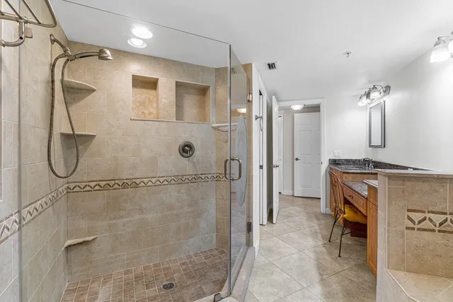 a bathroom with a shower and a sink