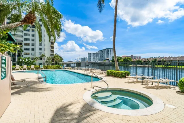 a view of a swimming pool with a lounge chair
