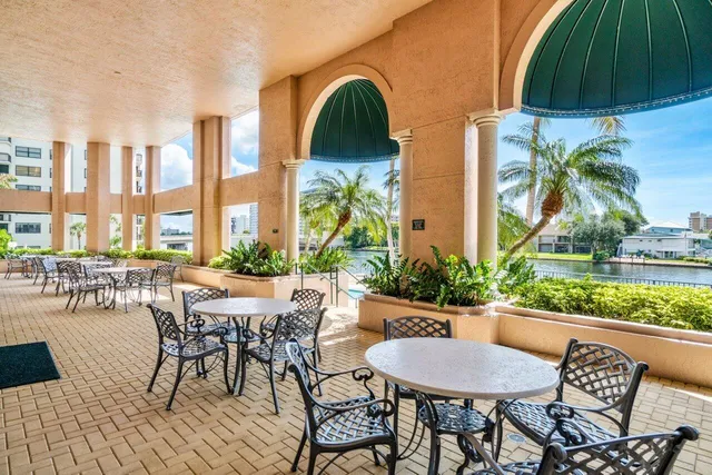 a view of a chairs and table in the patio