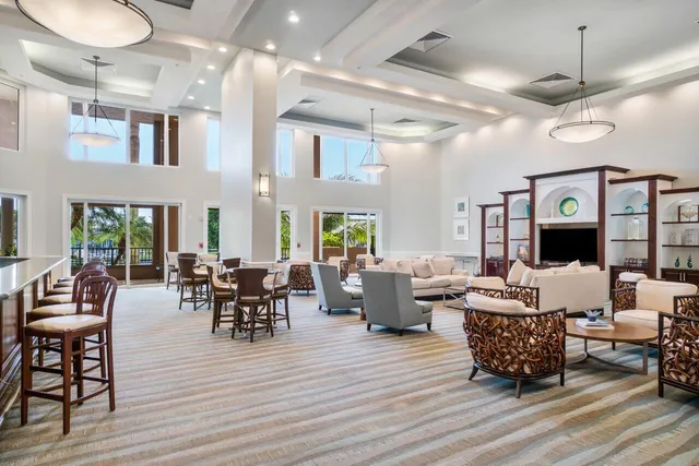 a living room with lots of furniture and wooden floor