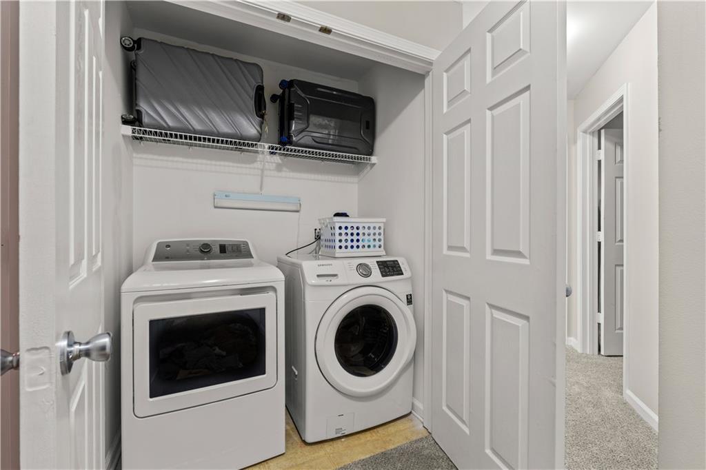141 Mill Pond Crossing, Unit L3 Carrollton, GA 30116 - Photo 11 of 21 a utility room with dryer and washer
