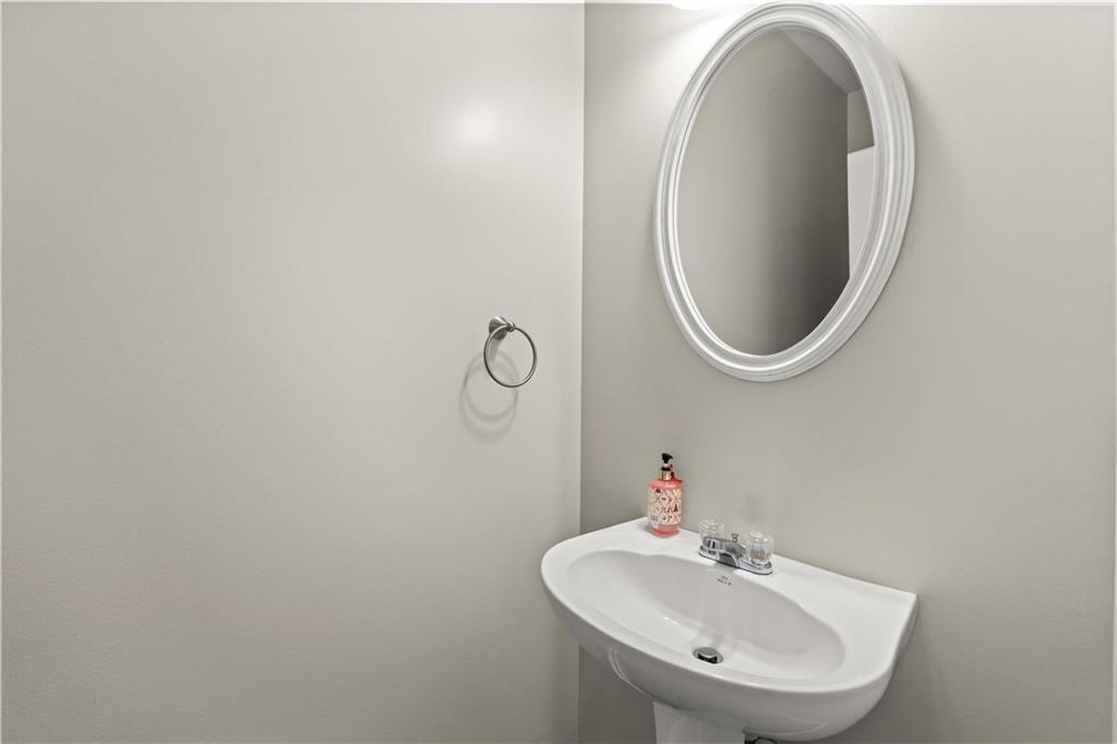 141 Mill Pond Crossing, Unit L3 Carrollton, GA 30116 - Photo 12 of 21 a bathroom with a sink and a mirror