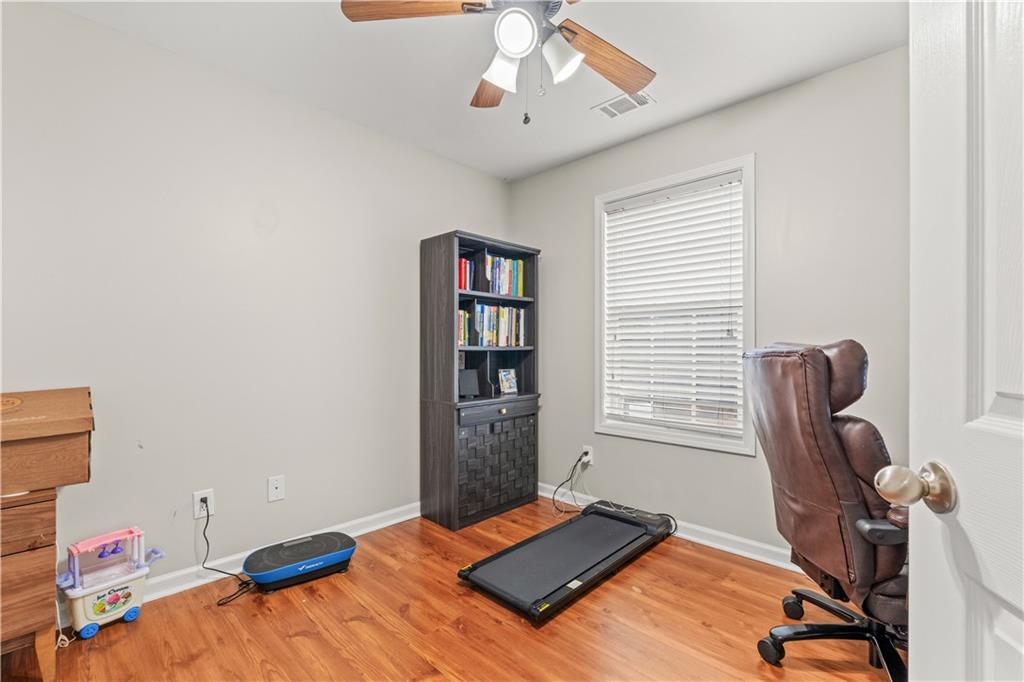 141 Mill Pond Crossing, Unit L3 Carrollton, GA 30116 - Photo 18 of 21 a bedroom with bed and furniture