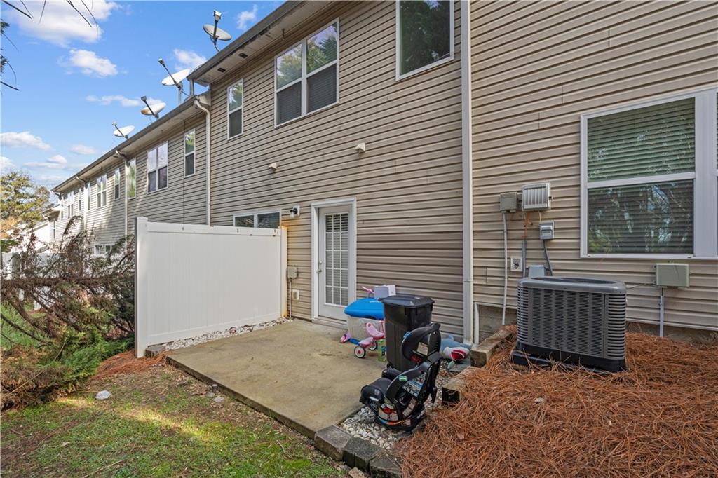 141 Mill Pond Crossing, Unit L3 Carrollton, GA 30116 - Photo 20 of 21 a view of backyard with deck and outdoor seating
