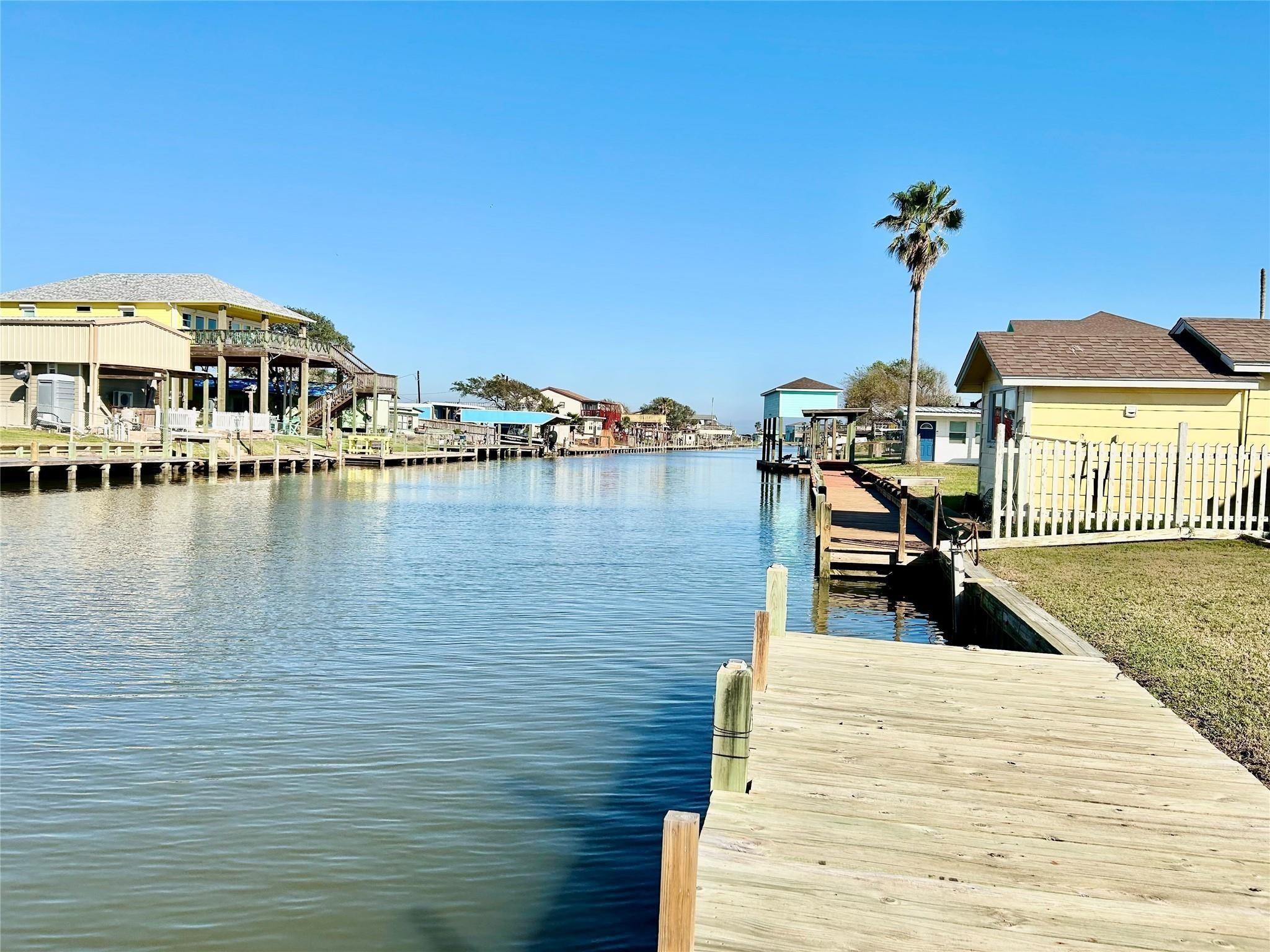 151 Neptune Bay City, TX 77414 - Photo 16 of 26 a view of a lake with houses
