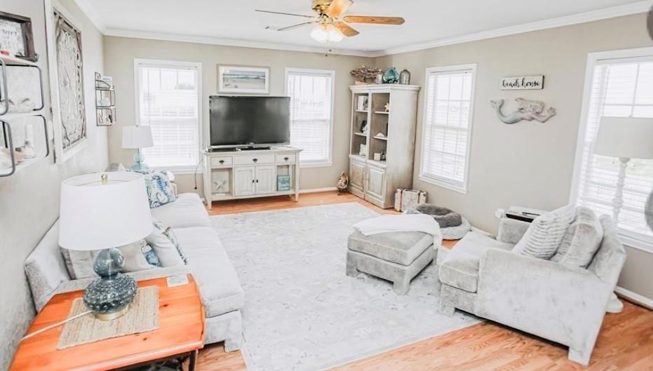 151 Neptune Bay City, TX 77414 - Photo 4 of 26 a living room with furniture and a flat screen tv