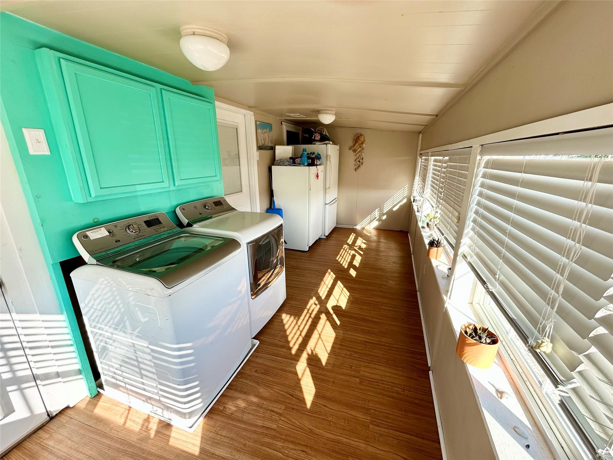151 Neptune Bay City, TX 77414 - Photo 6 of 26 a kitchen with sink and refrigerator