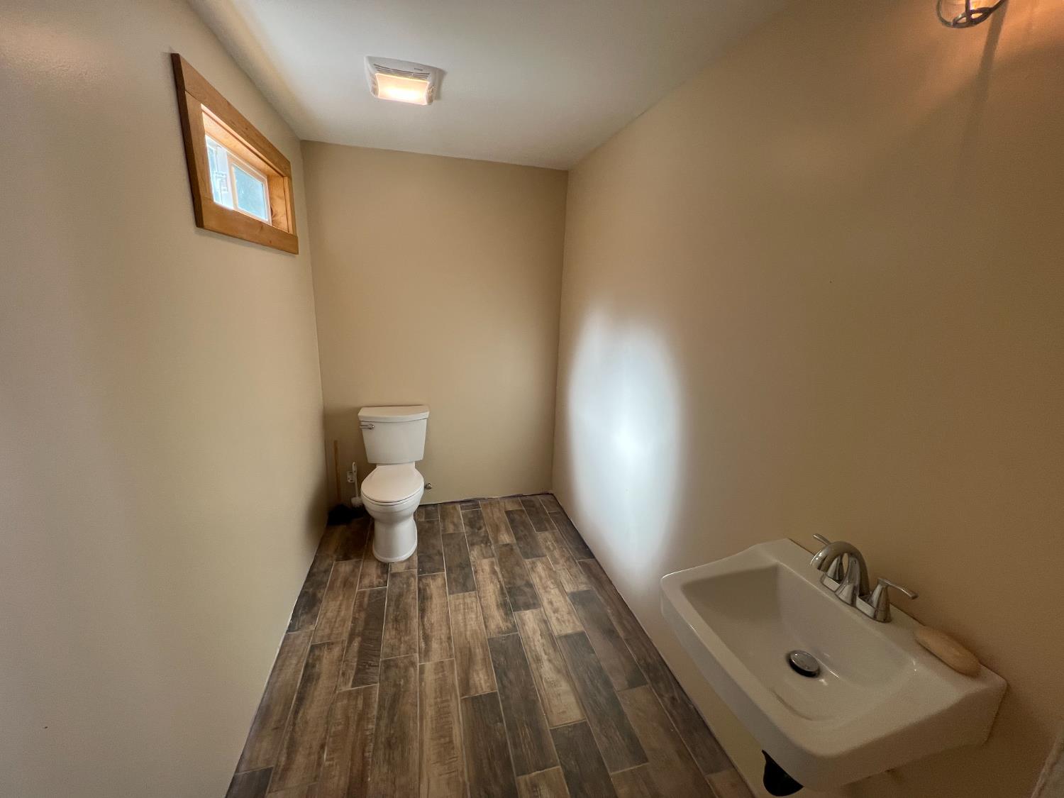 7935 Fairplay Road Somerset, CA 95684 - Photo 7 of 19 a bathroom with a sink and a toilet