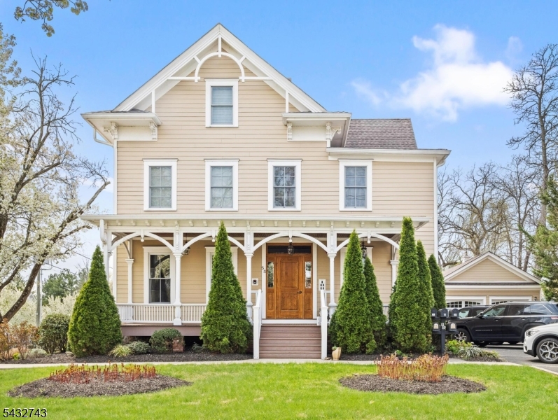 55 Main Street Chatham, NJ 07928 - Photo 1 of 14 a front view of a house with garden