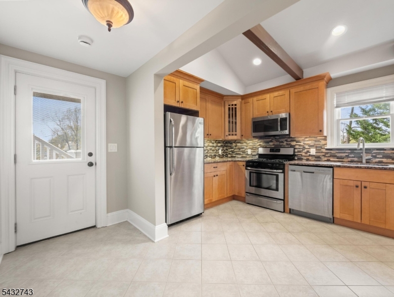 55 Main Street Chatham, NJ 07928 - Photo 11 of 14 a kitchen with stainless steel appliances granite countertop a refrigerator sink and stove