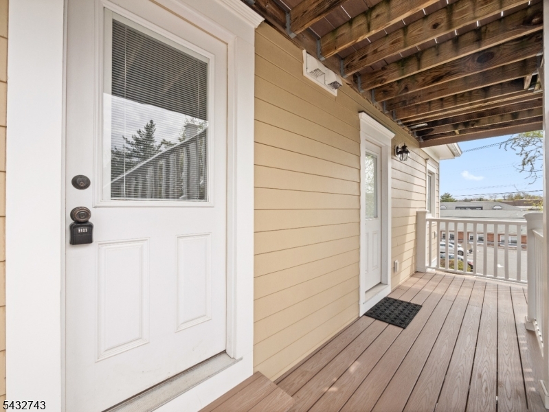 55 Main Street Chatham, NJ 07928 - Photo 12 of 14 a view of a balcony with wooden floor