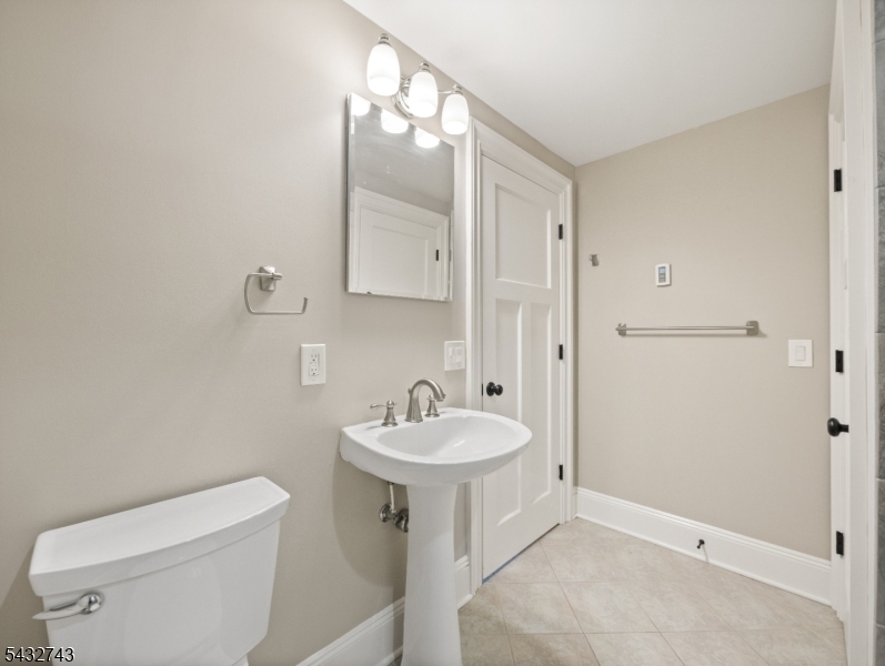 55 Main Street Chatham, NJ 07928 - Photo 6 of 14 a bathroom with a sink toilet and vanity